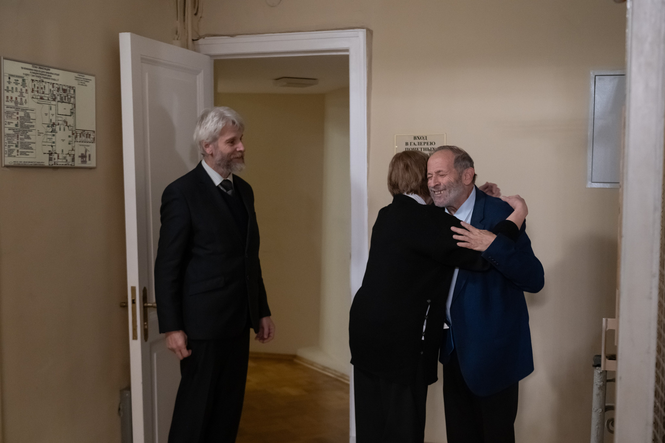 Colleagues embrace Boris Vishnevsky after he announced his resignation.