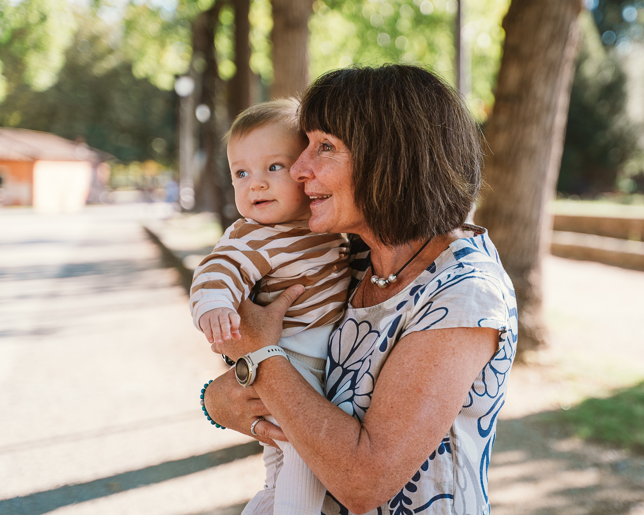 Grandmothers sharing a heartfelt moment with their grandchildren in Tuscany.
