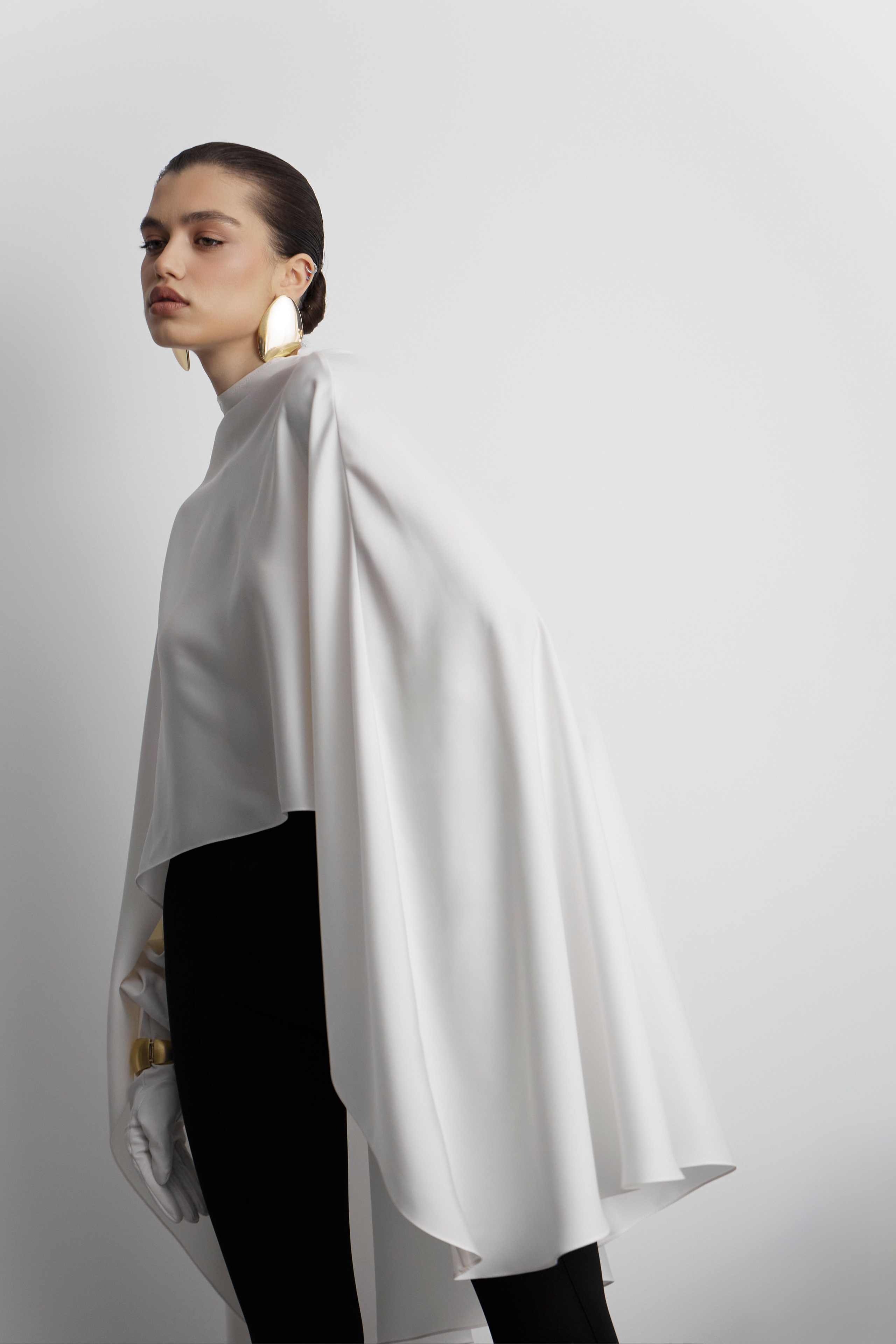 Fashion lookbook side profile portrait of model in minimalist white garment photographed for contemporary fashion brand campaign in Sydney