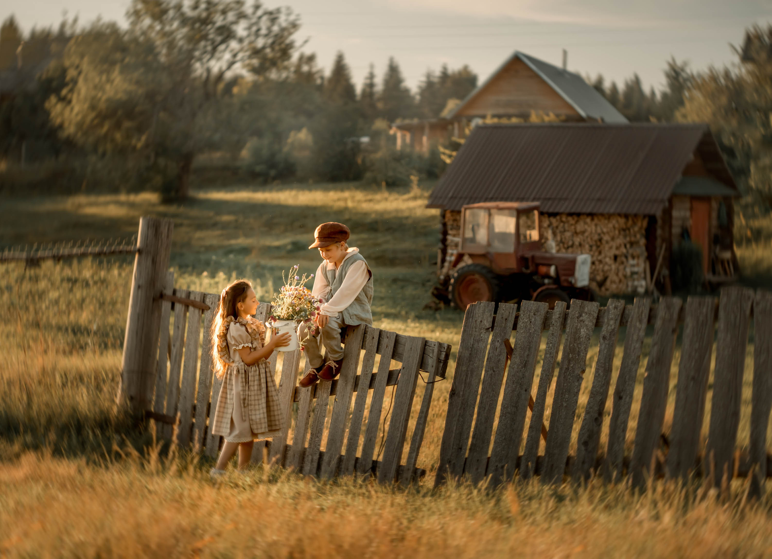 Nostalgia of the Rural childhood. Rural childhood. A boy and a girl. Grandmother. Grandchild. Photo shoot in the village. Village photos. Village summer
