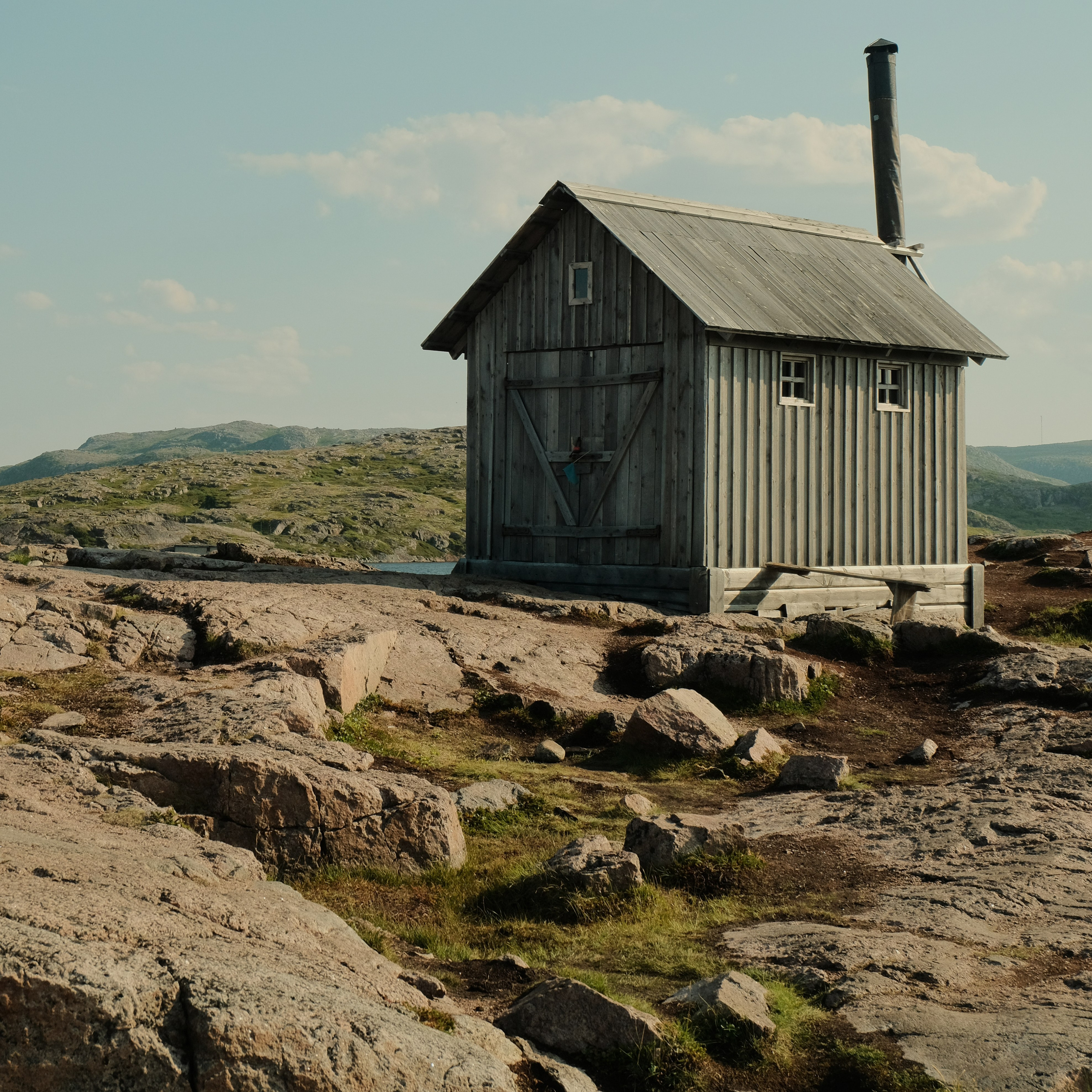small building on a rocky area