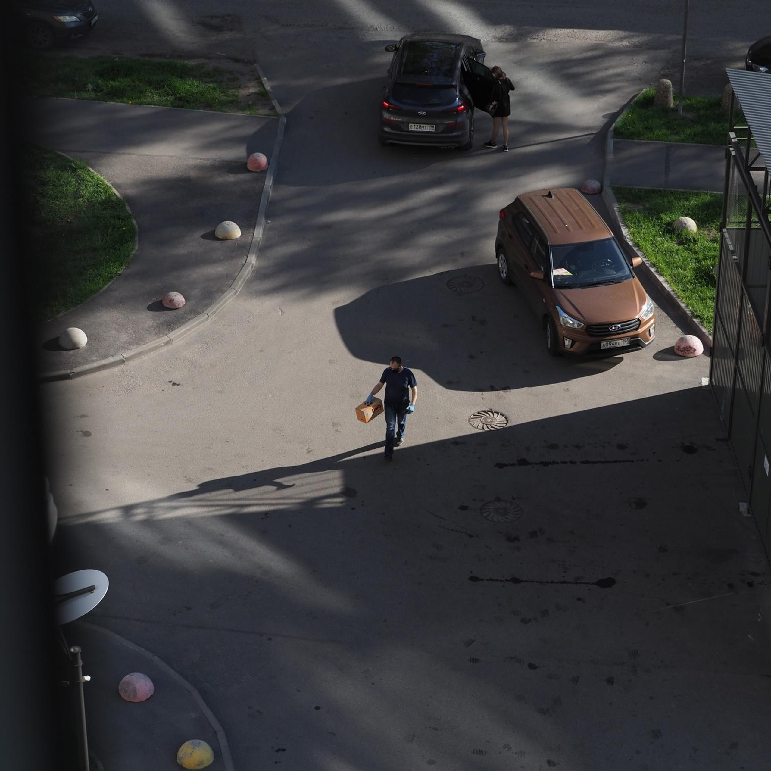 May 26, 2020, A courier wearing a mask and gloves.