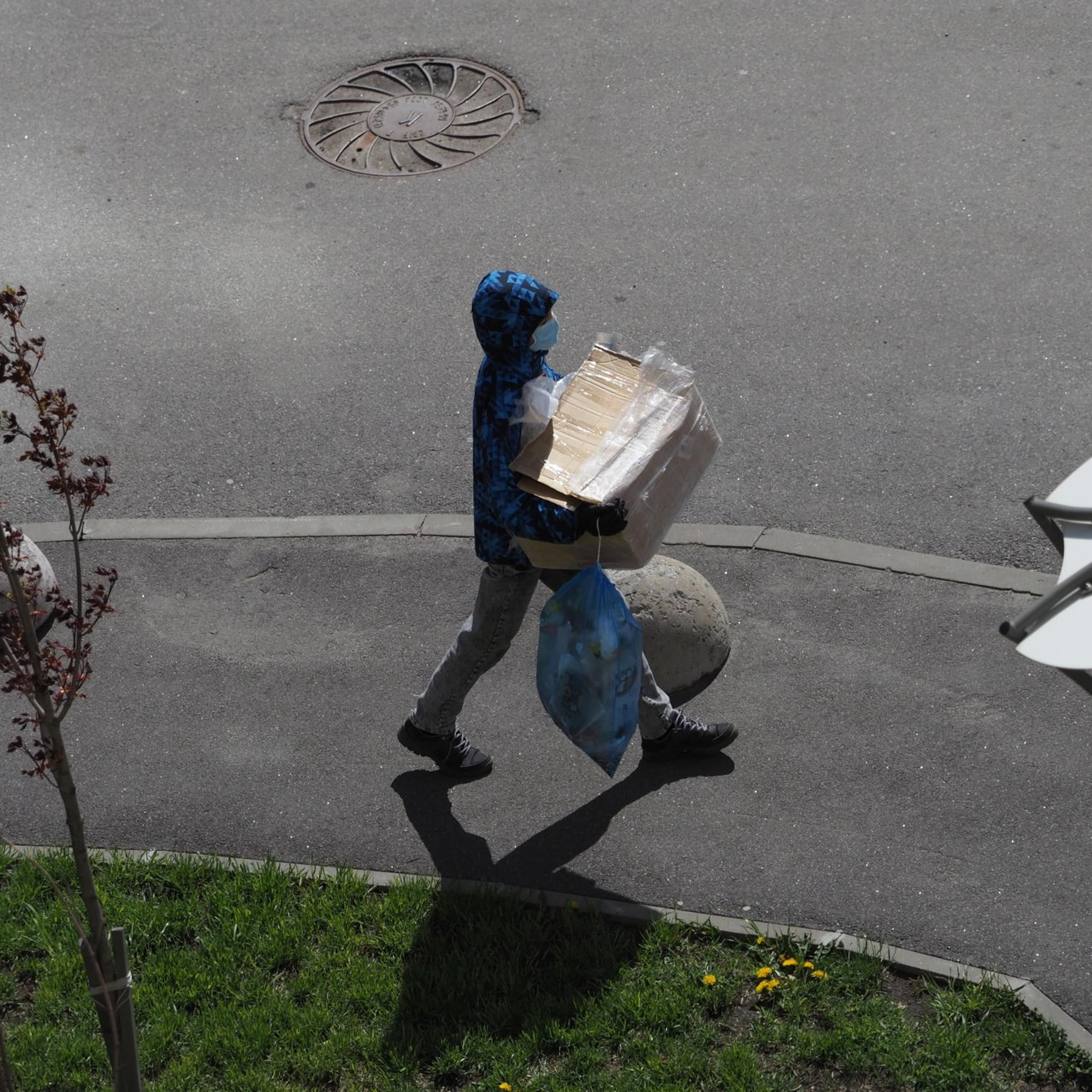 May 17, 2020, A neighbor takes out the trash.