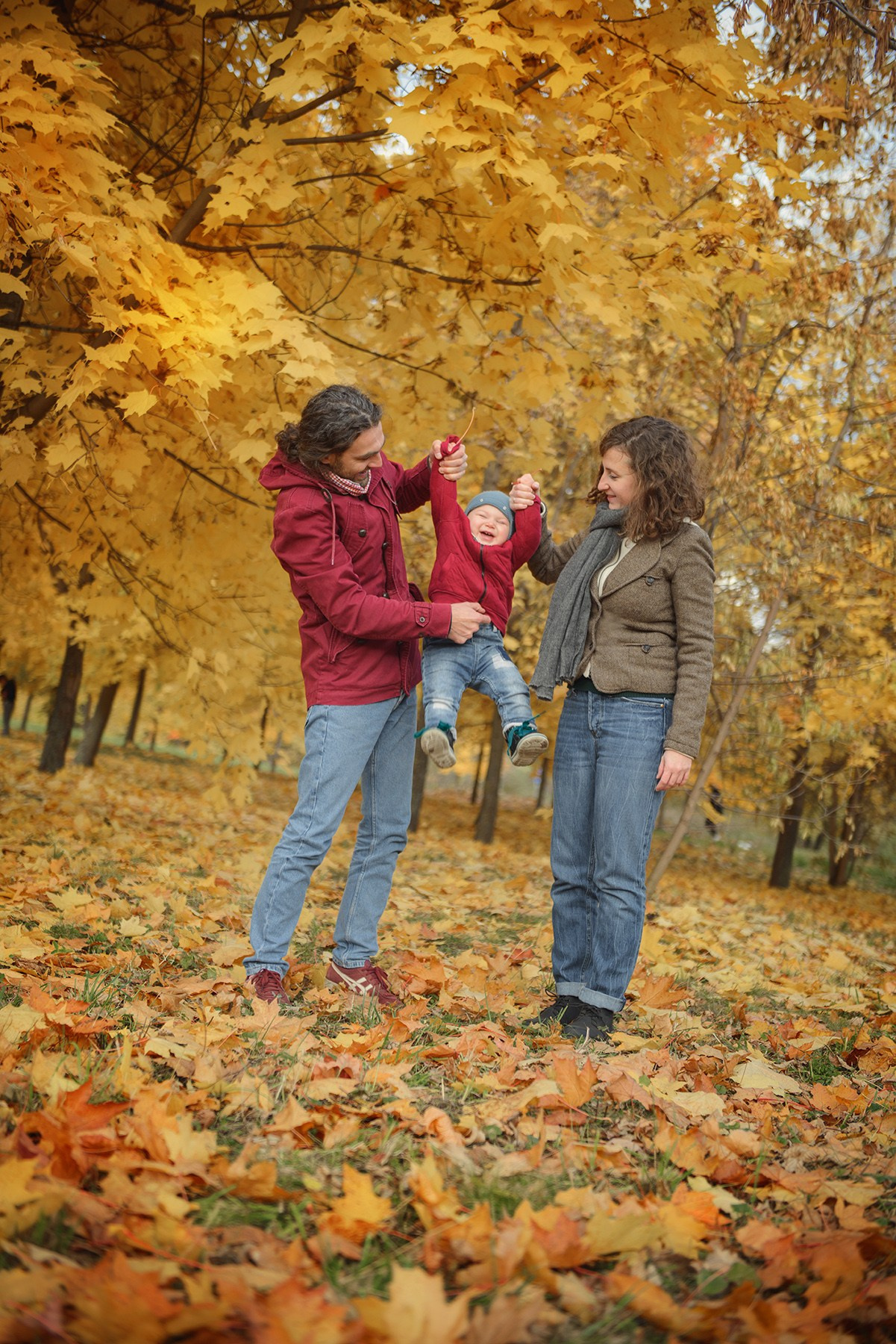 Family photo shoot in autumn. Photos with yellow leaves