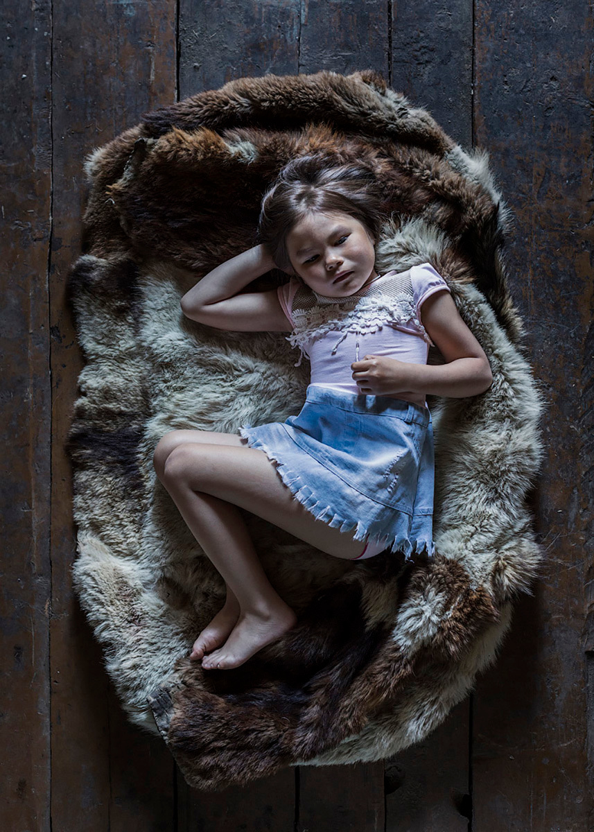 Irishka pose on the old «parka» - hunting coat. Far North, Siberia by Elena Anosova