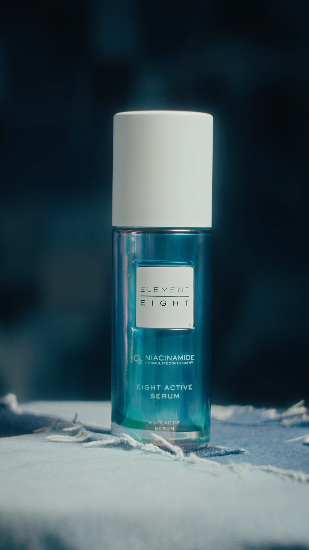 Luxury skincare product bottle displayed in a refined studio setup, showcasing elegance.