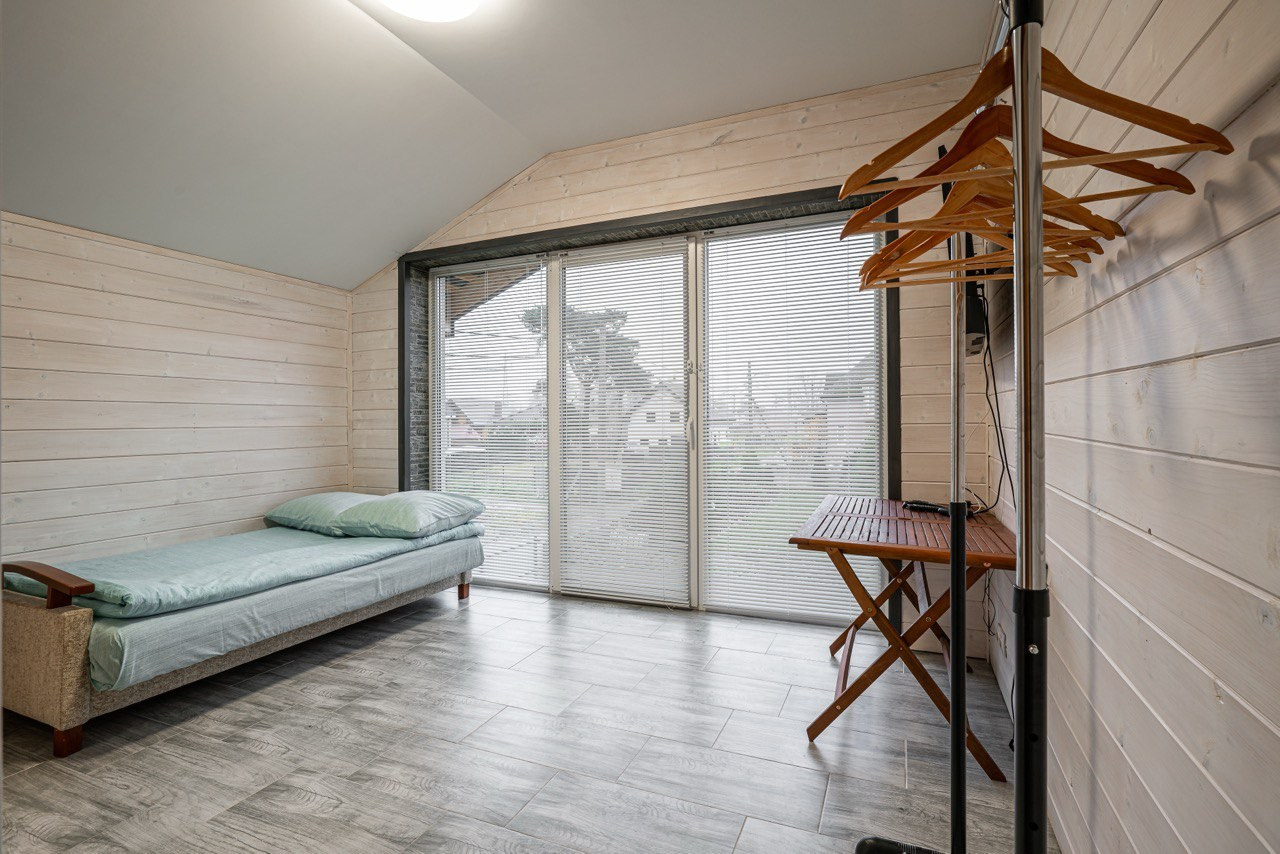 спальня в коттедже в Заостровье