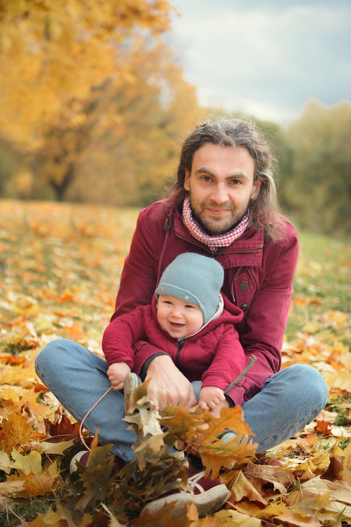 Photo shoot of a little child in autumn. Photos with yellow leaves