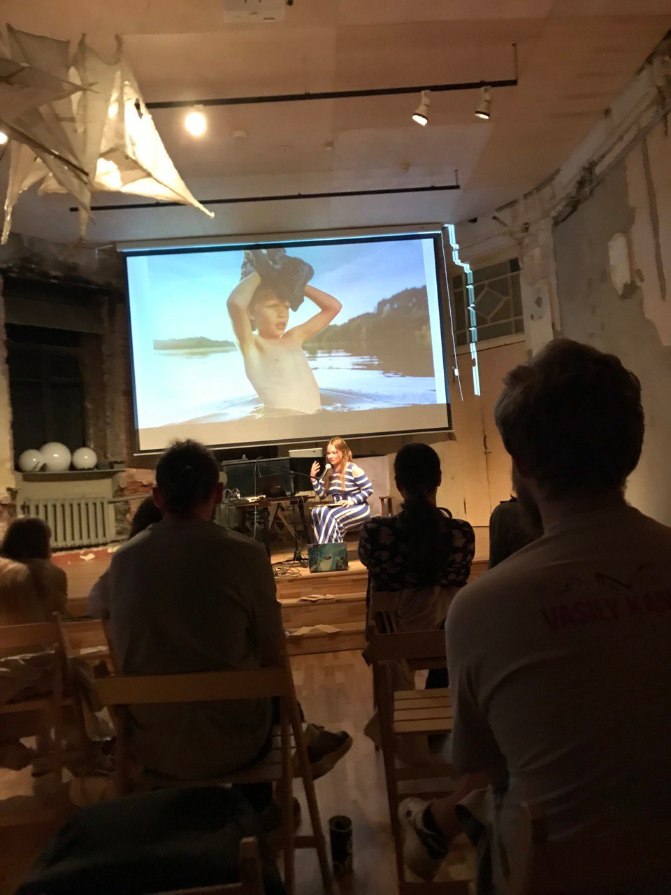 Olga Mikhalchuk is telling the audience the history of “The HARD” book. Olga Mikhalchuk, visual artist