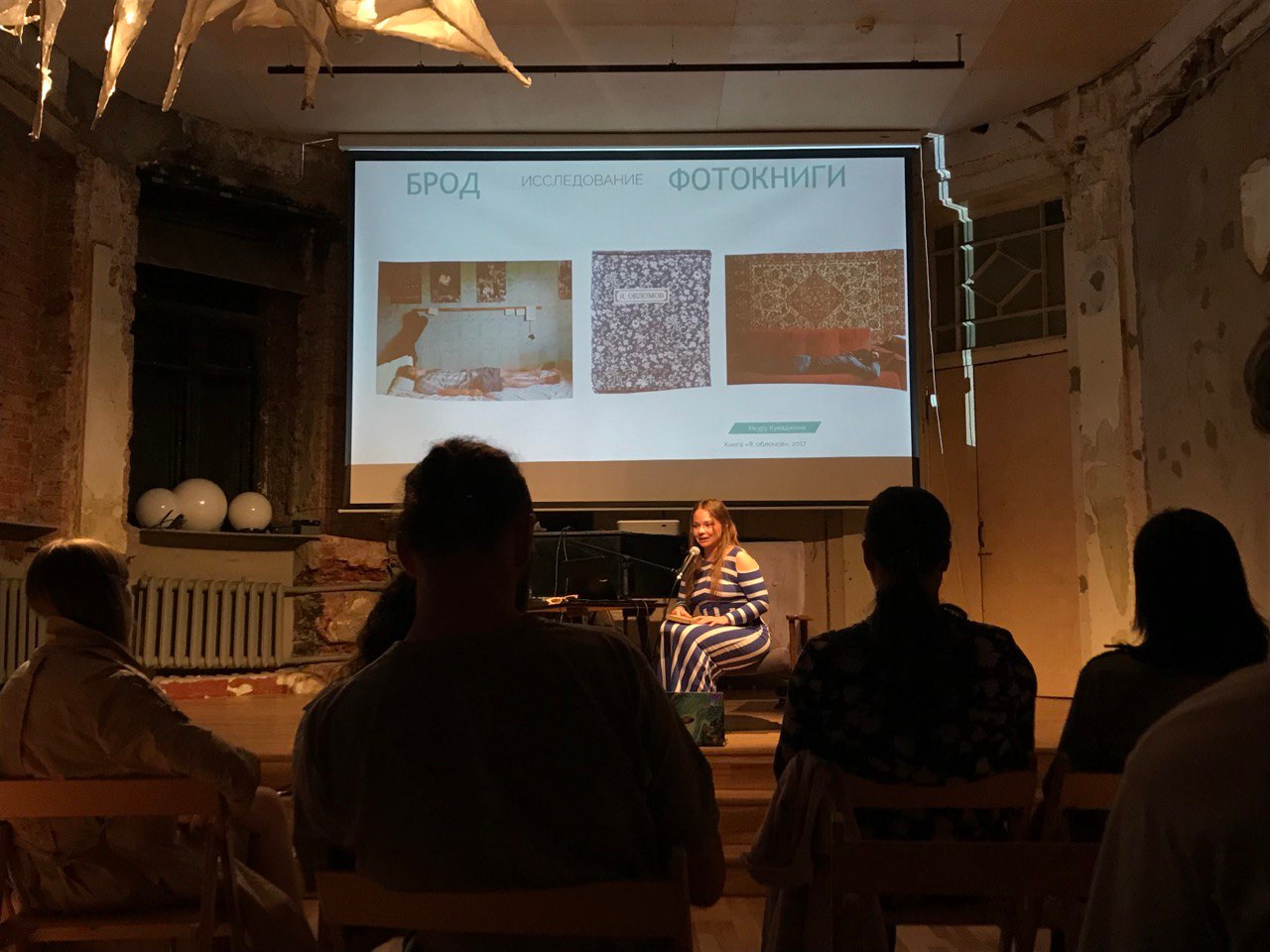 Olga Mikhalchuk is telling the audience the history of “The HARD” book. Olga Mikhalchuk, visual artist