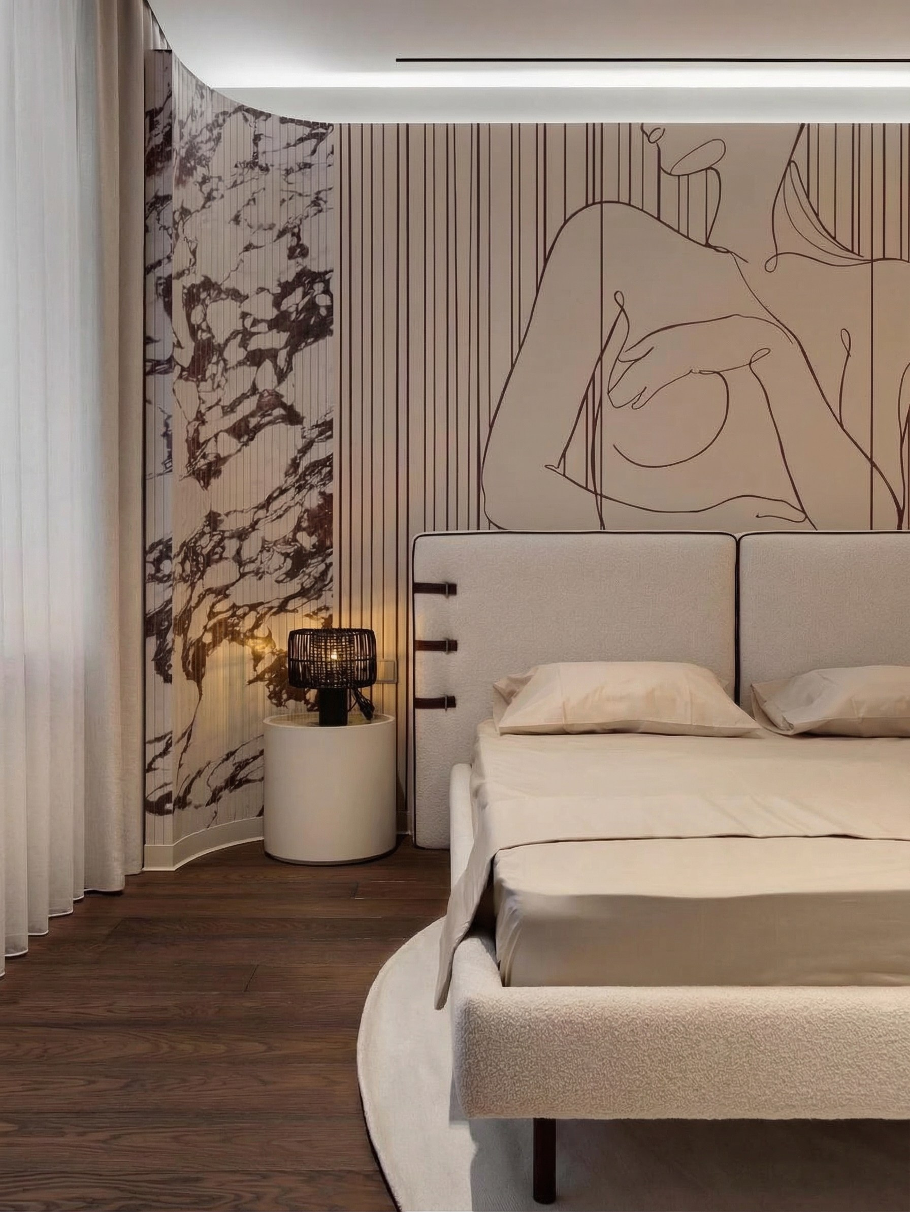 Дизайн мастер-спальни от Валерии Котович: радиусная панель из камня, барельеф на стене, кровать в обивке букле и архитектурная подсветка потолка.