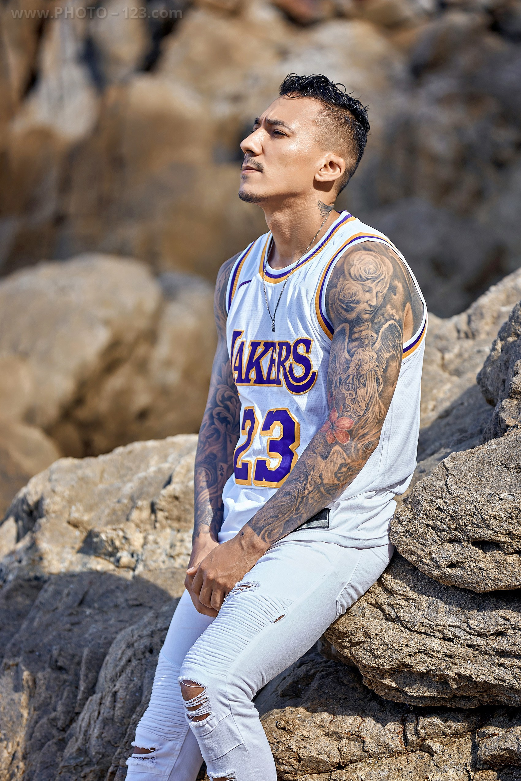 Athletic male portrait session on a rocky coast in Nha Trang Vietnam