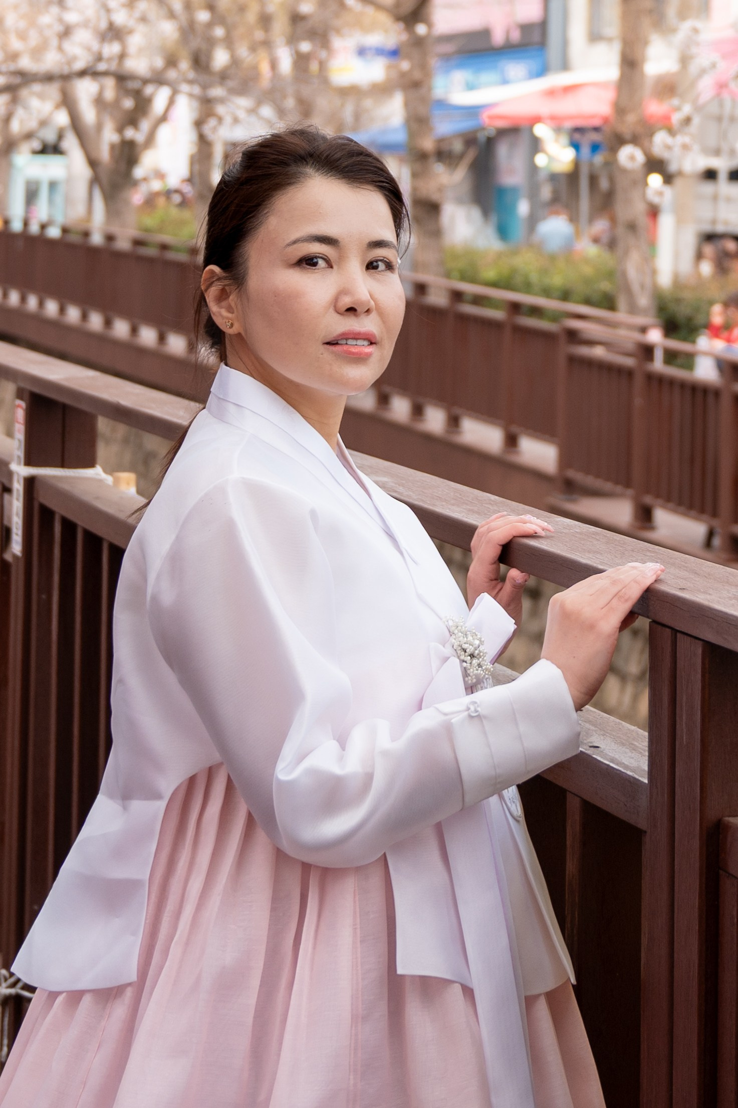 Woman in hanbok portrait with cherry blossoms in Busan Korea