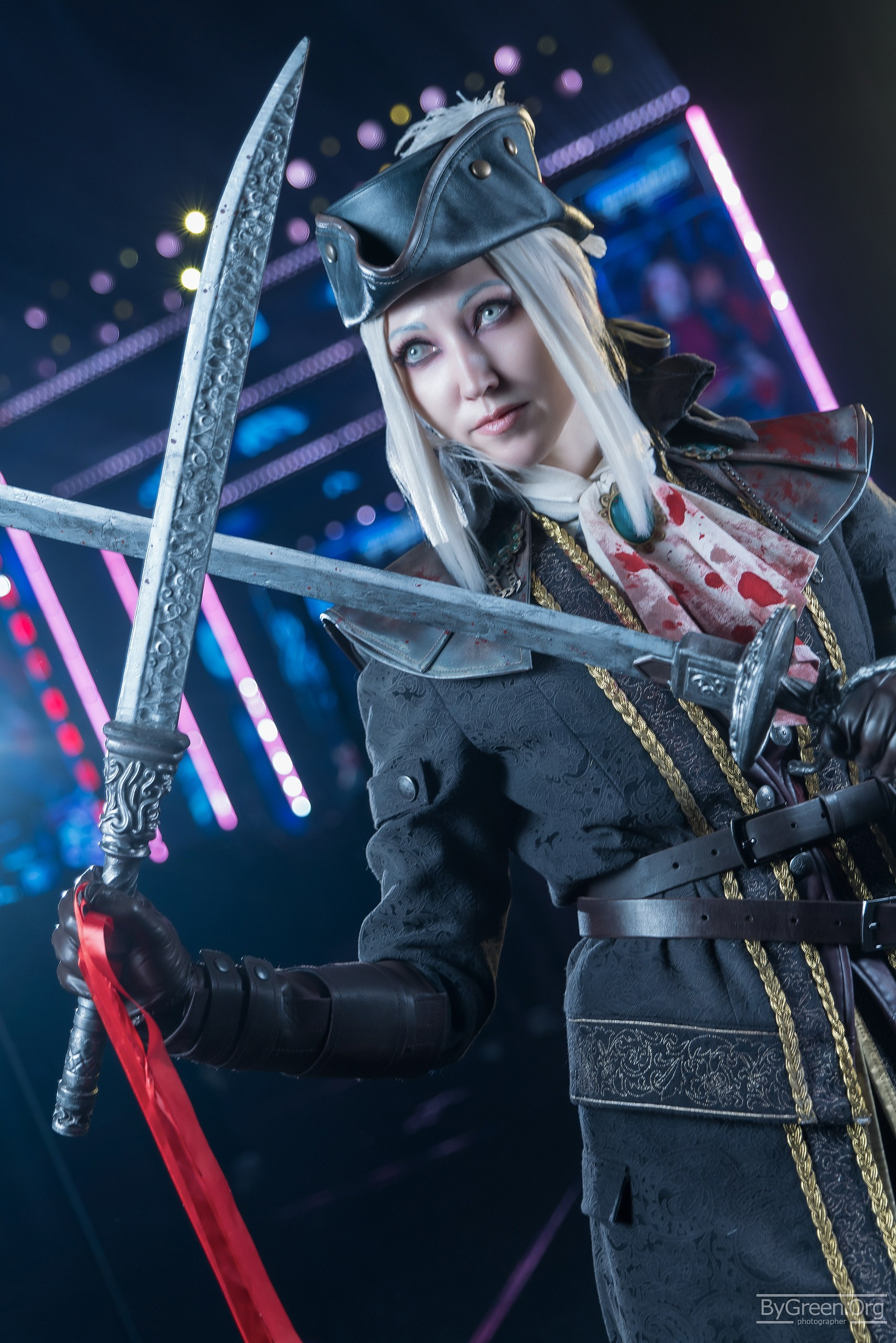 Cosplay of Lady Maria from Bloodborne — tricorn hat and twin blades, Fandom Fest 2026, Moscow