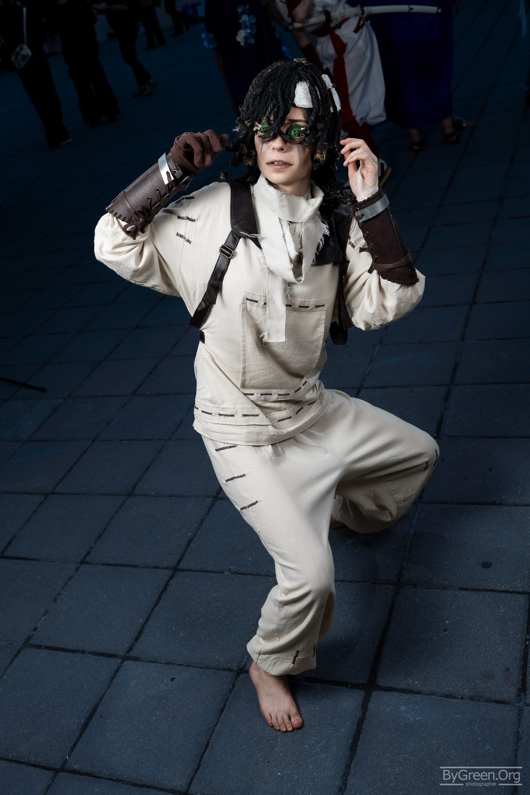 Cosplay of Emil from Identity V — light patient outfit, crouching, VIBE.CON 2026, Moscow