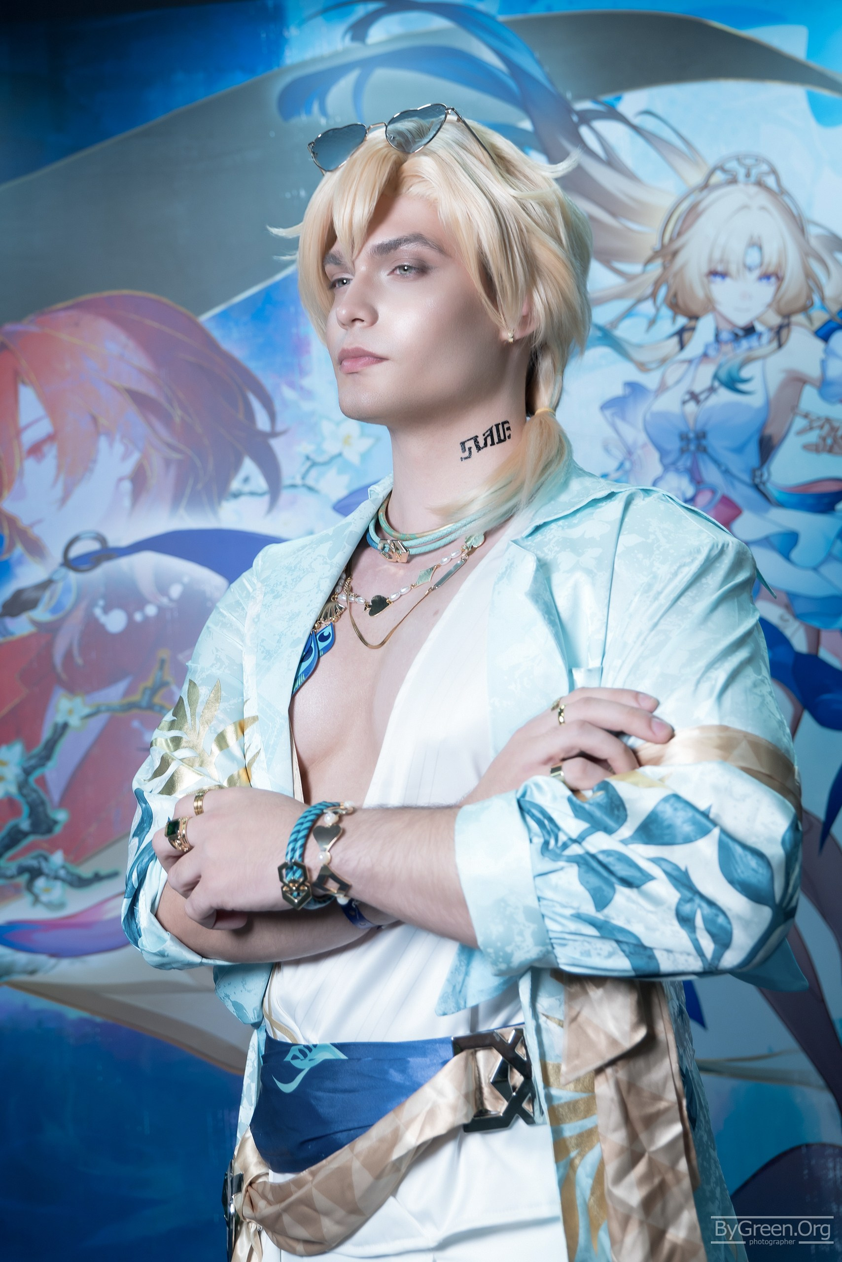 Cosplay of Aventurine from Honkai: Star Rail — blond in white and gold, Fandom Fest 2026, Moscow