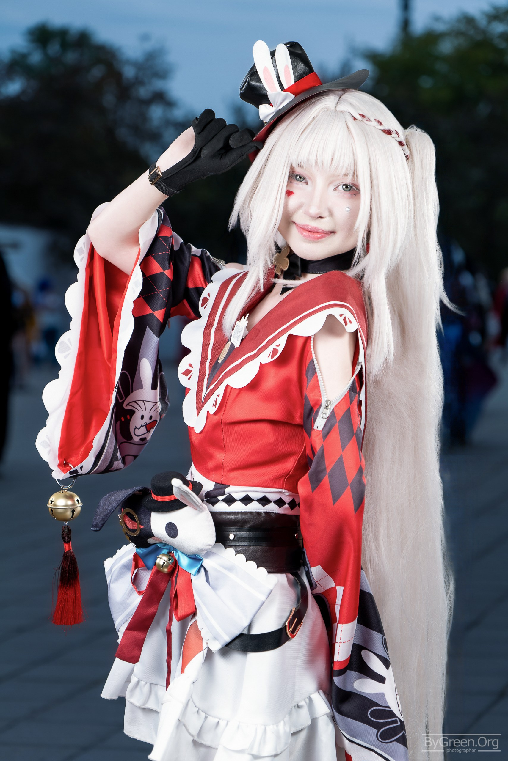 Cosplay of Sparkle from Honkai: Star Rail — red and white outfit, playful pose, VIBE.CON 2026, Moscow