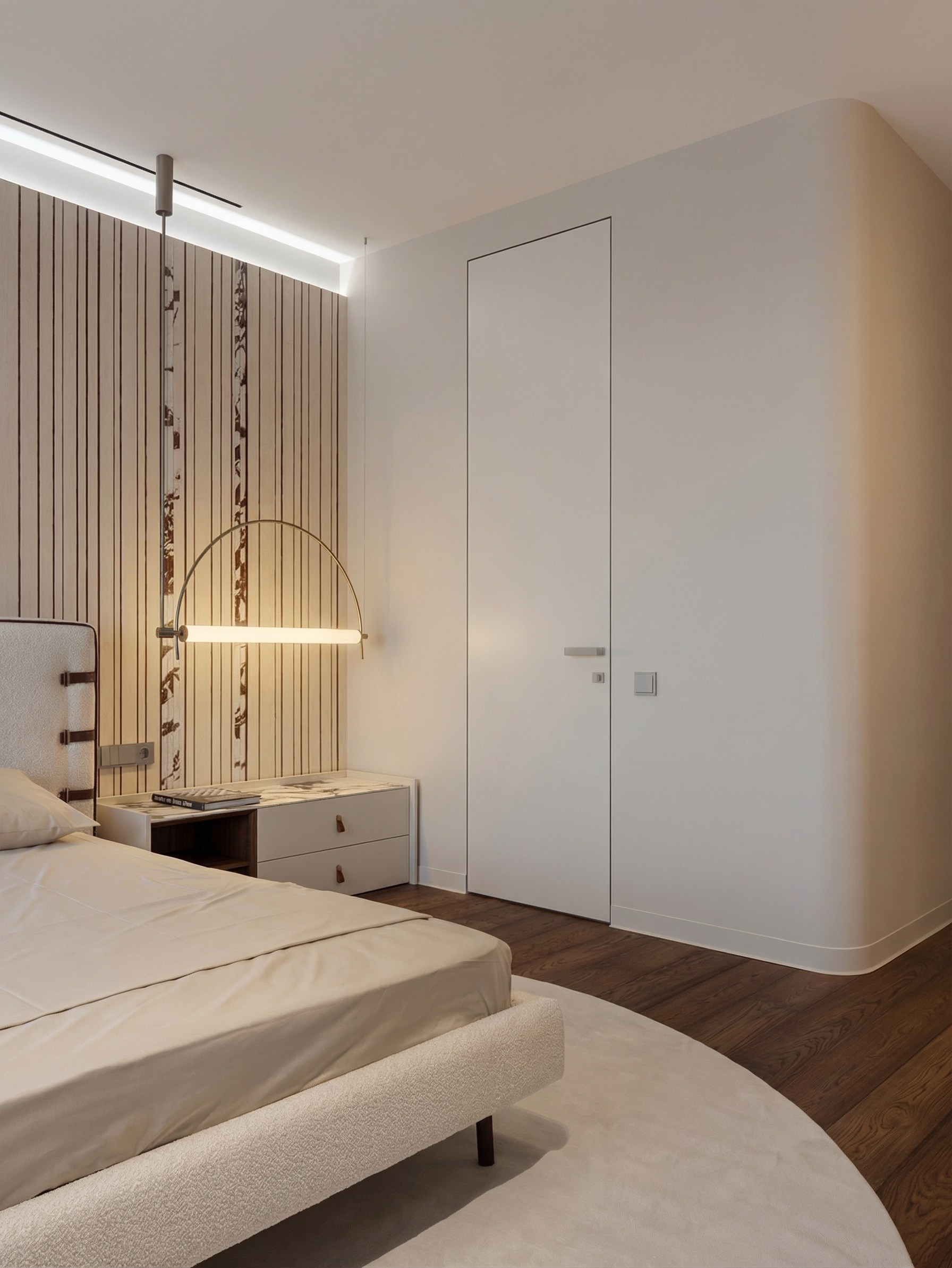 Интерьер спальни от Валерии Котович: скрытая дверь в потолок, радиусный угол стены, дизайнерское панно и графичный светильник над тумбой из камня.