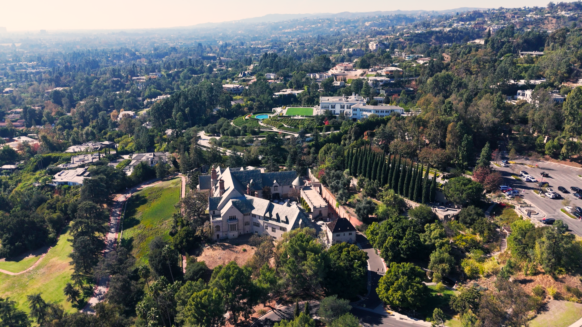 Aerial view of a lush green residential area in Los Angeles, highlighting the city's unique blend of nature and urban living.