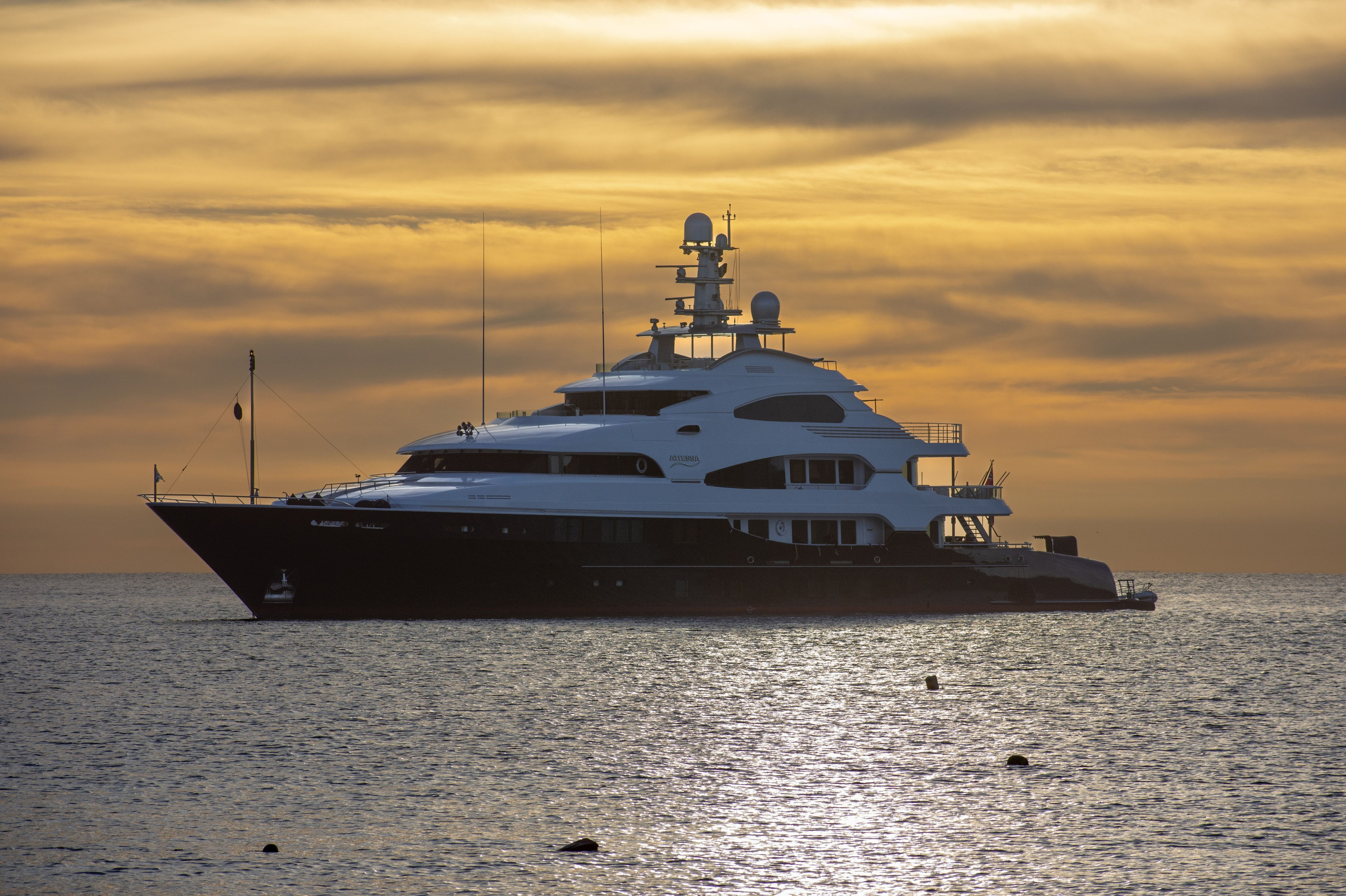 Private yacht charter at sunset, available worldwide