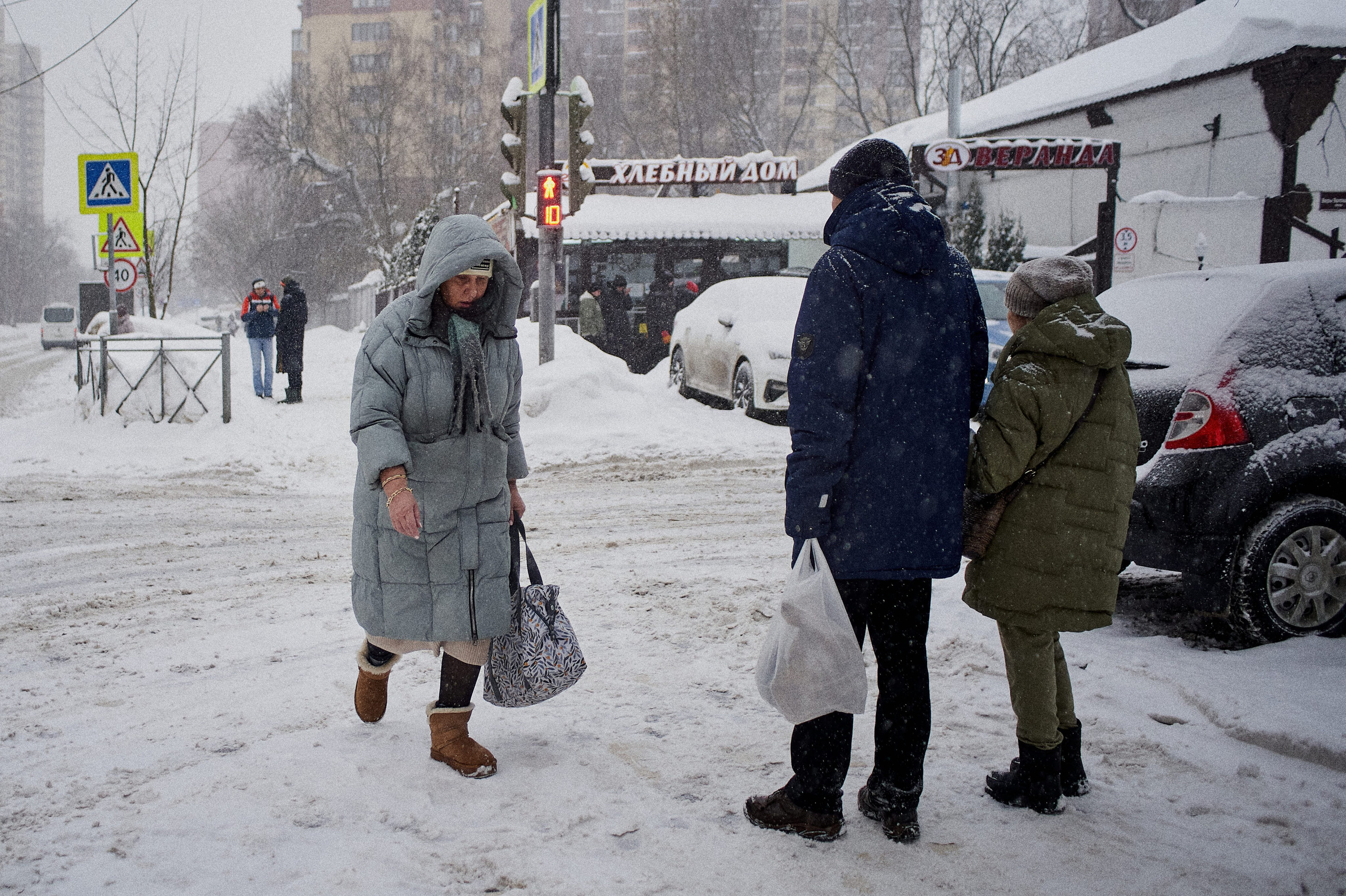 Moscow residents in winter. People walking along snow-covered streets in Moscow during winter.
