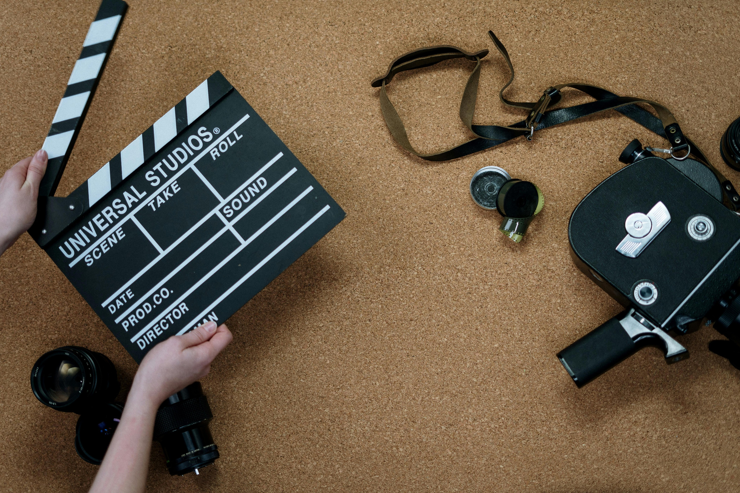 Filmmaking Essentials Clapperboard and Vintage Camera on Set
