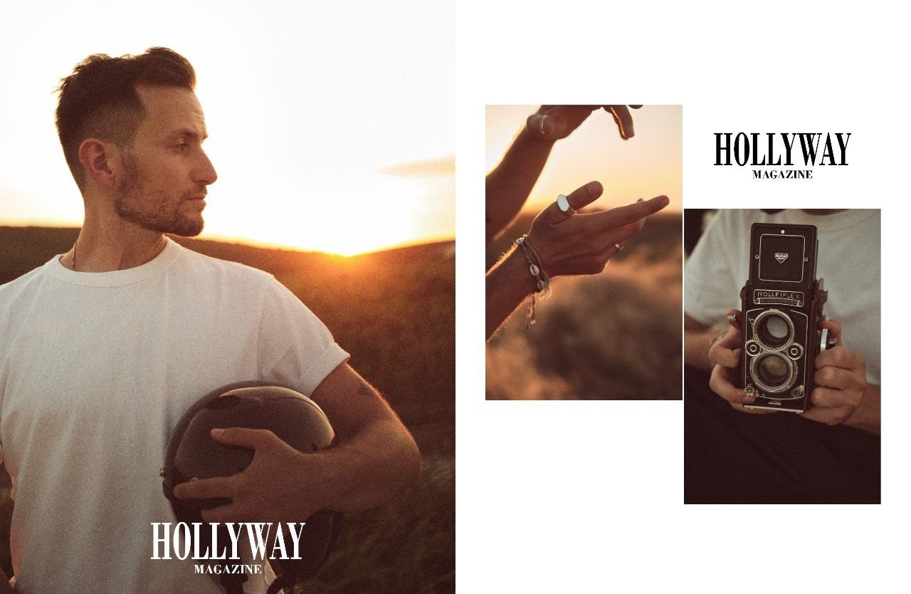 Мужчина с мотоциклетным шлемом в руках