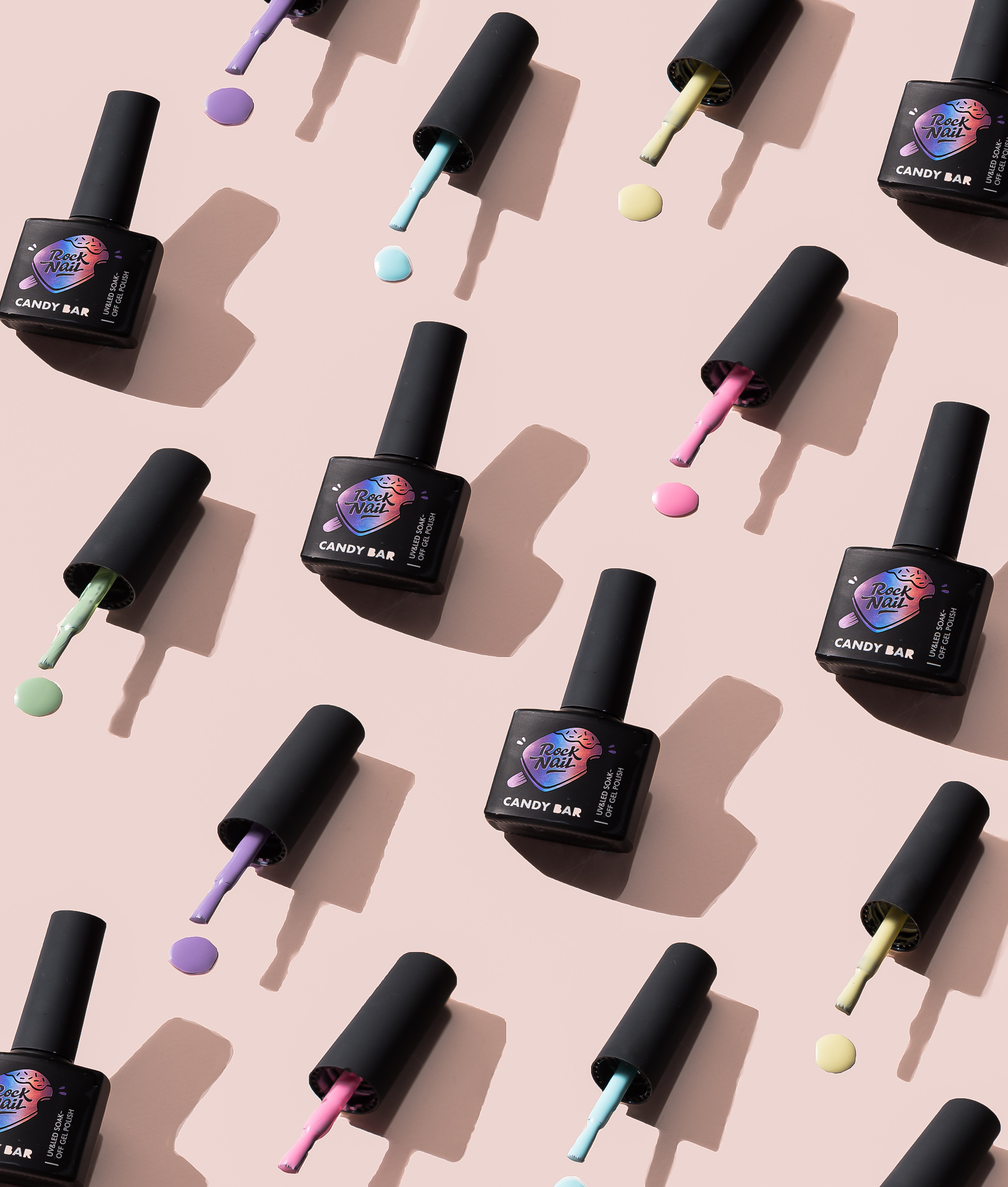 Модный паттерн с лаками для ногтей и капельками лака. Яркий, сочный и солнечный кадр для хорошего настроения и высоких продаж.