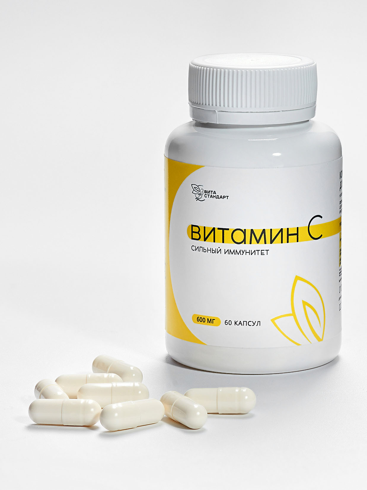 Витамины в капсулах - съемка белого на белом с тенью