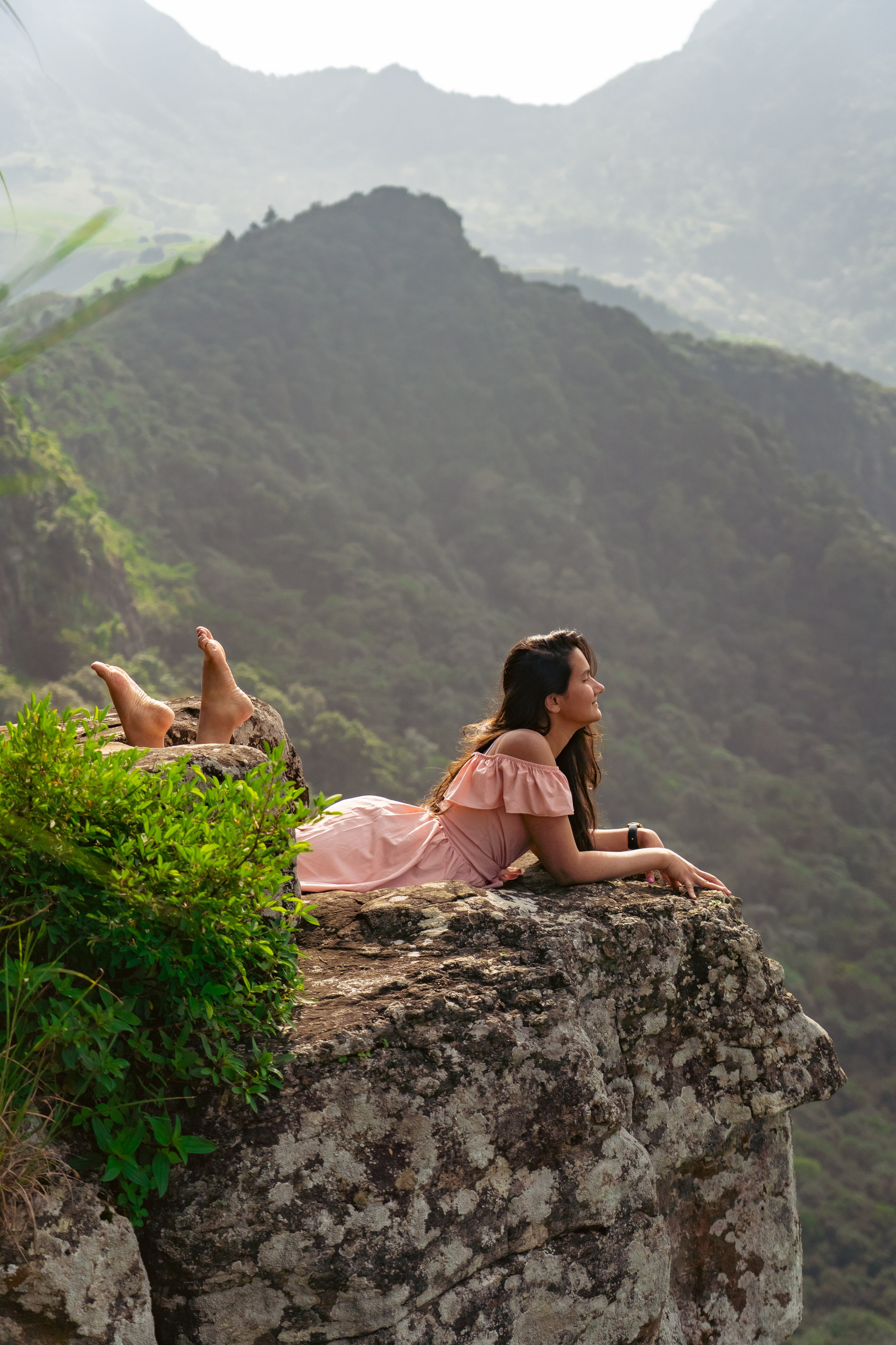 Peacock Hill, Sri Lanka: a beautiful young girl in a pink dress standing at the edge of a cliff