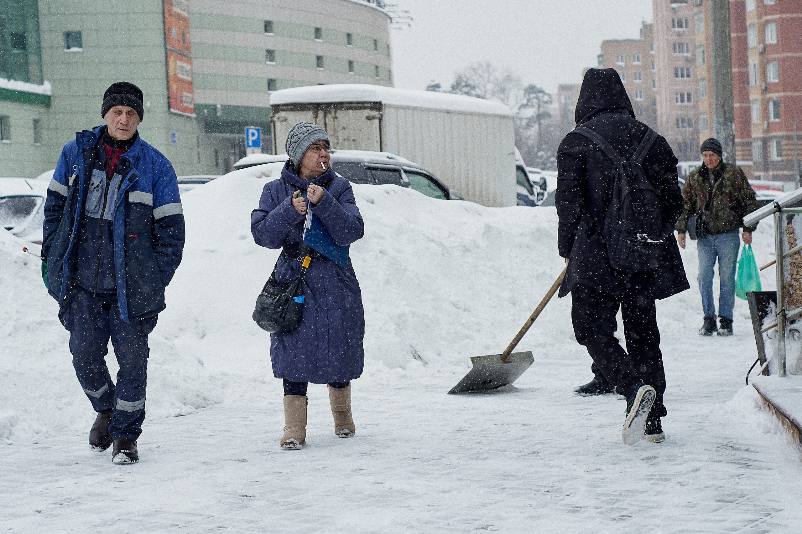 Snowdrifts in Russia. Large piles of snow accumulated along urban streets after heavy snowfall.