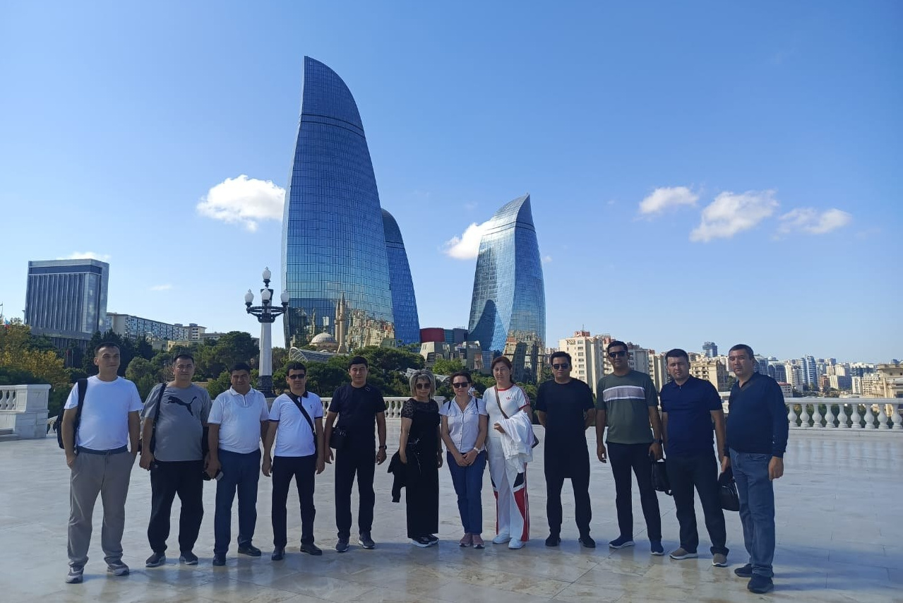 Corporate incentive trip group photo in front of the Flame Towers, Baku, Highland Park
