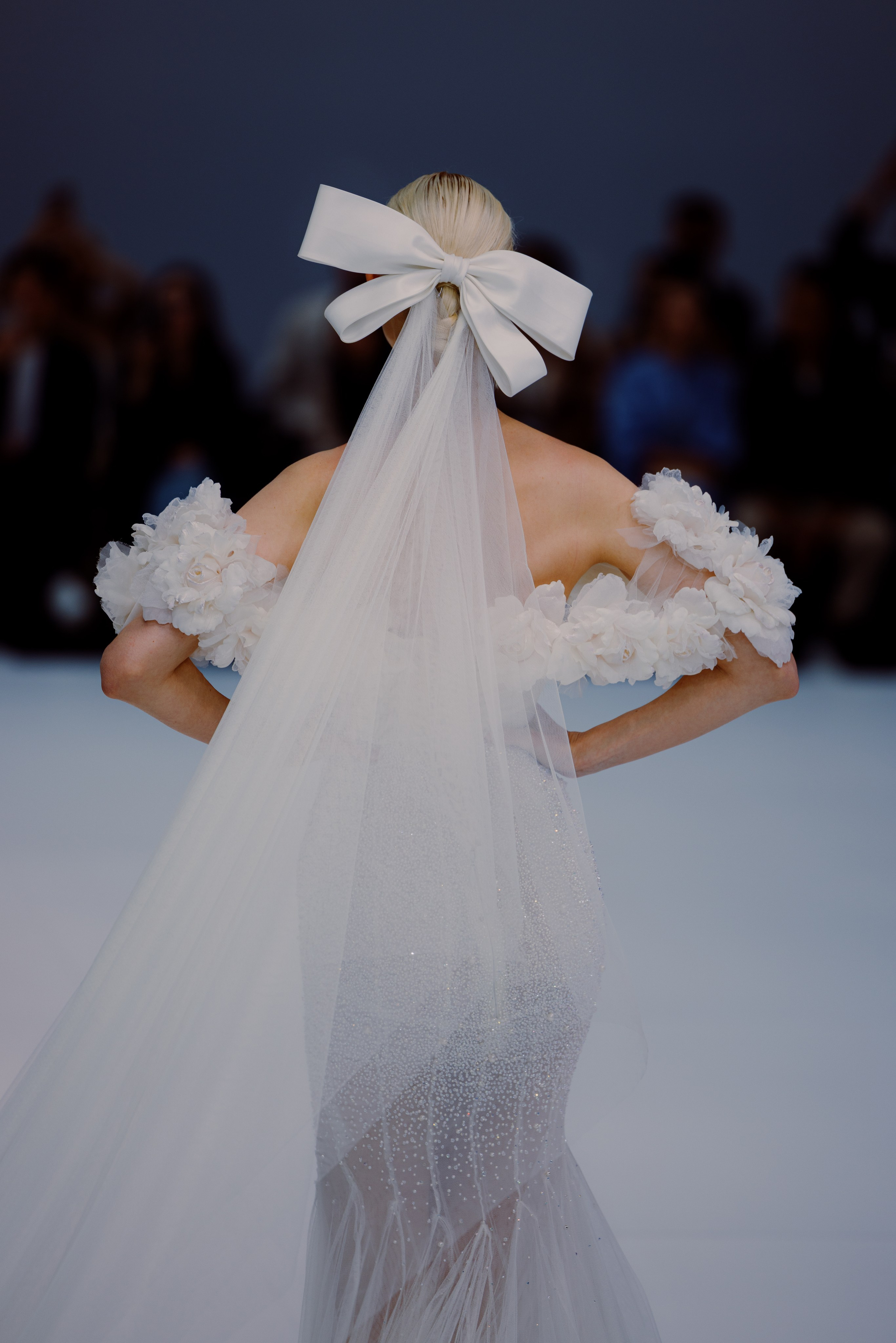 Designer giving final touch backstage before BBFW show