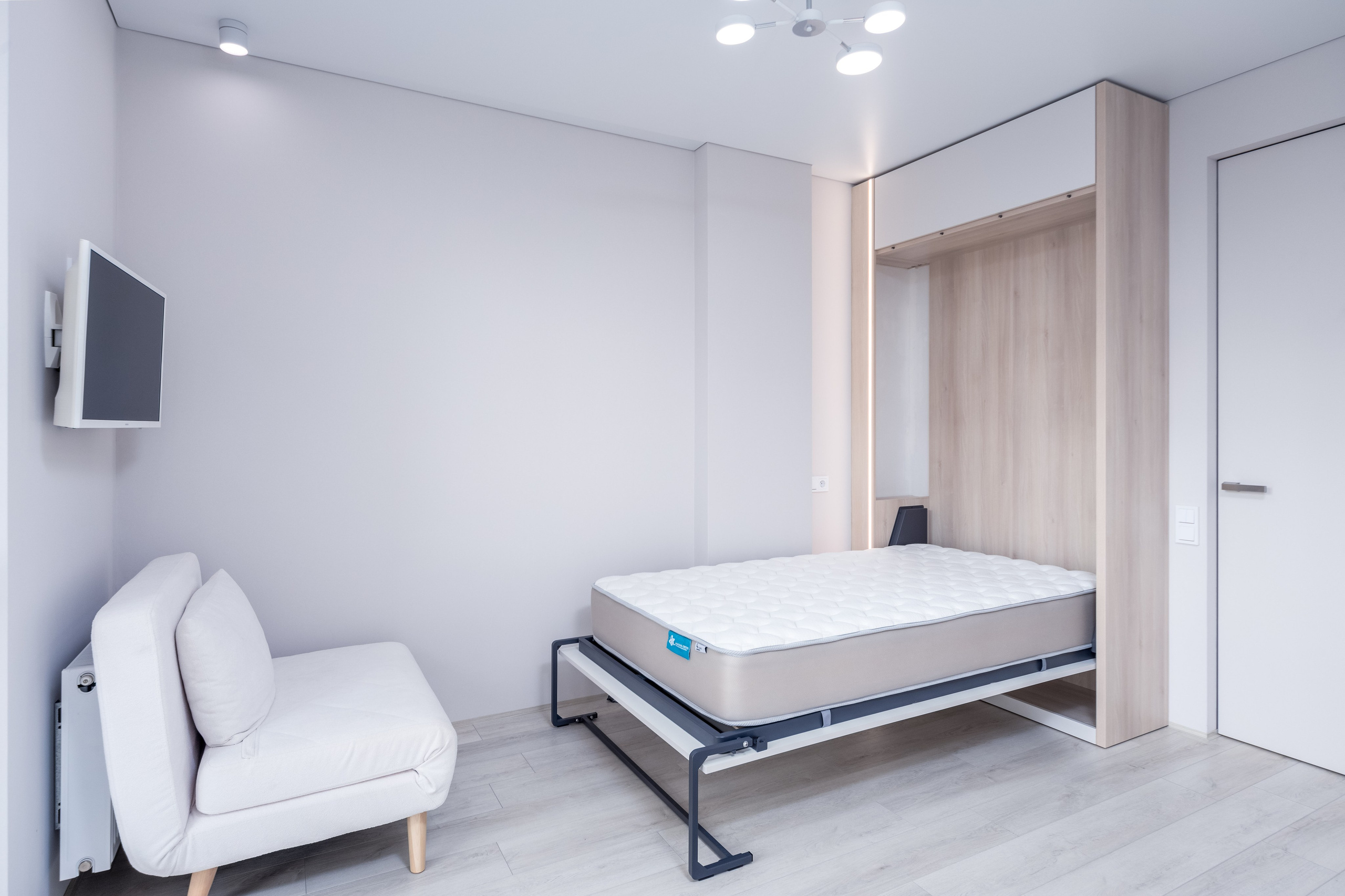 Разложенная кровать-трансформер и ТВ-зона в детской комнате в квартире в Минск Мир