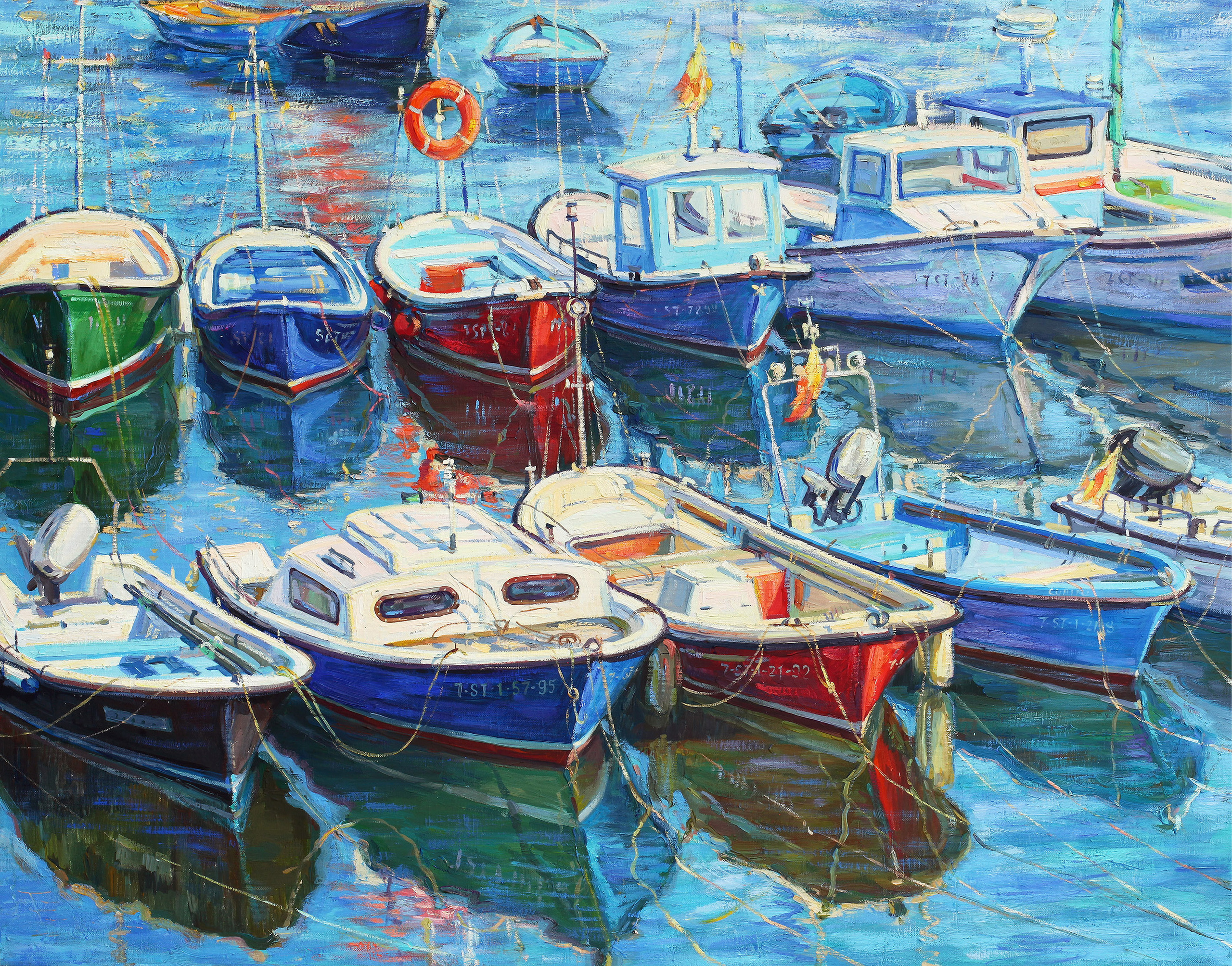 Two rows of colorful fishing boats
