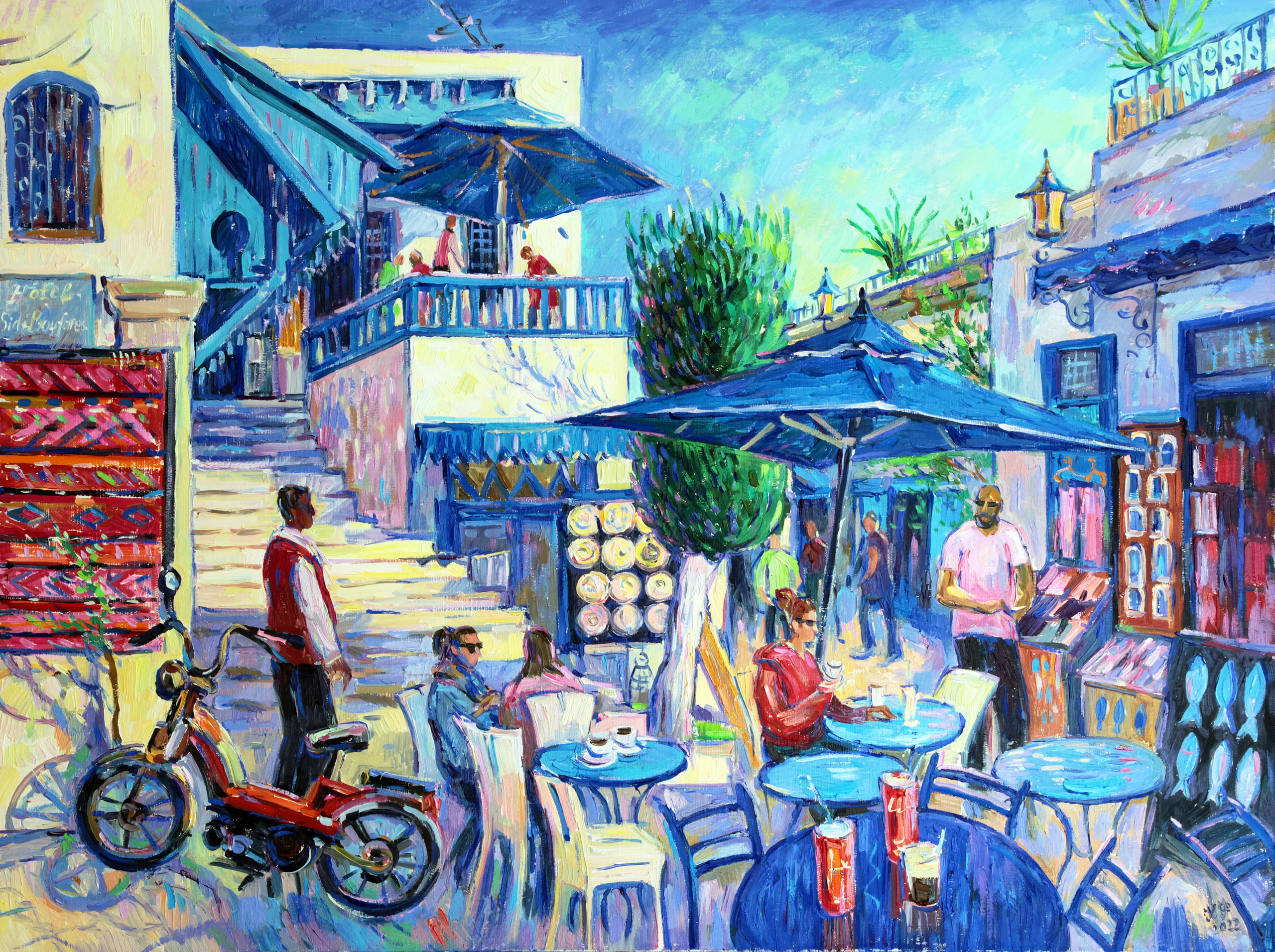 A few people at Café des Nattes and a souvenir seller