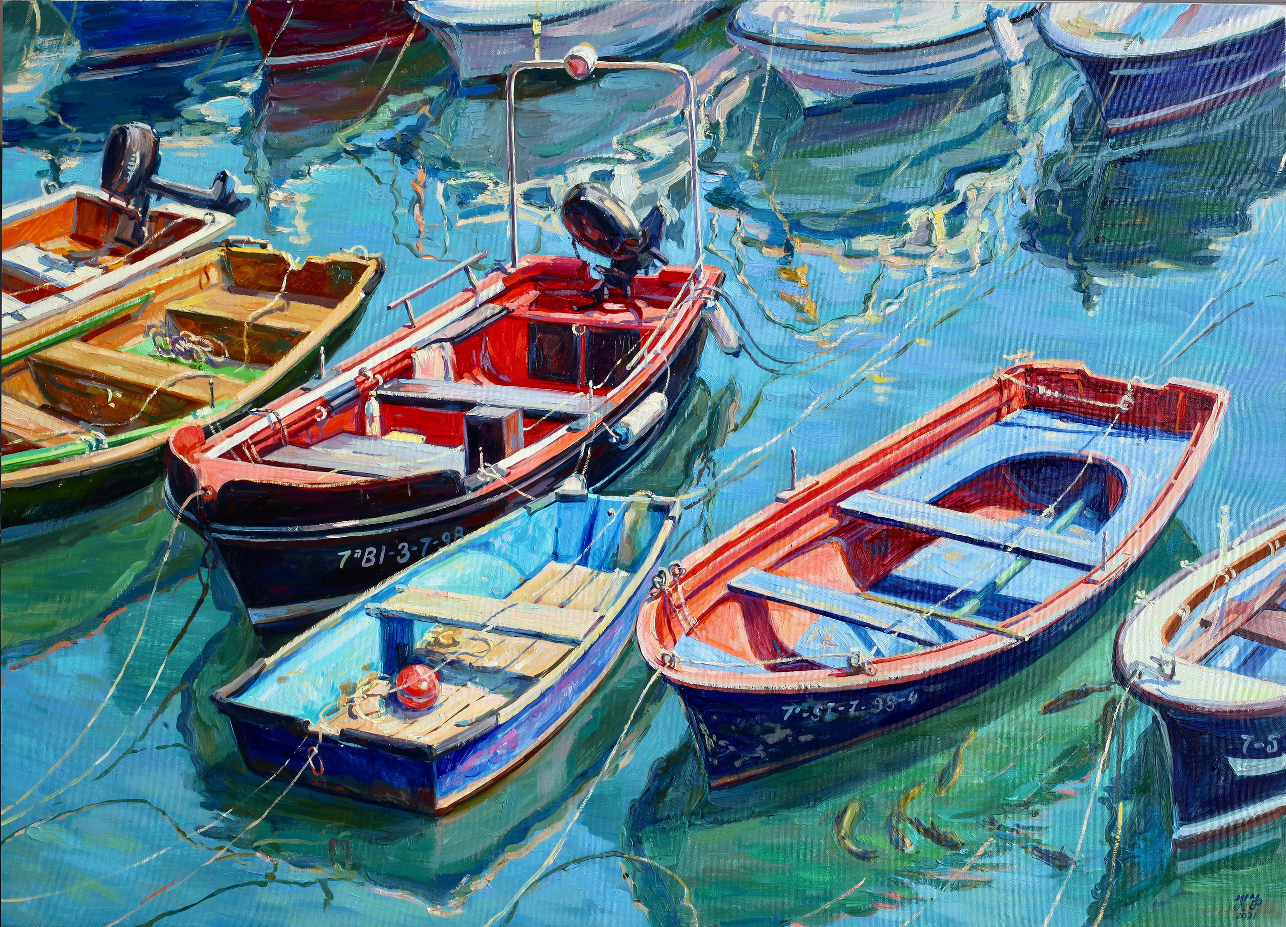 Red and orange fishing boats moored in a row