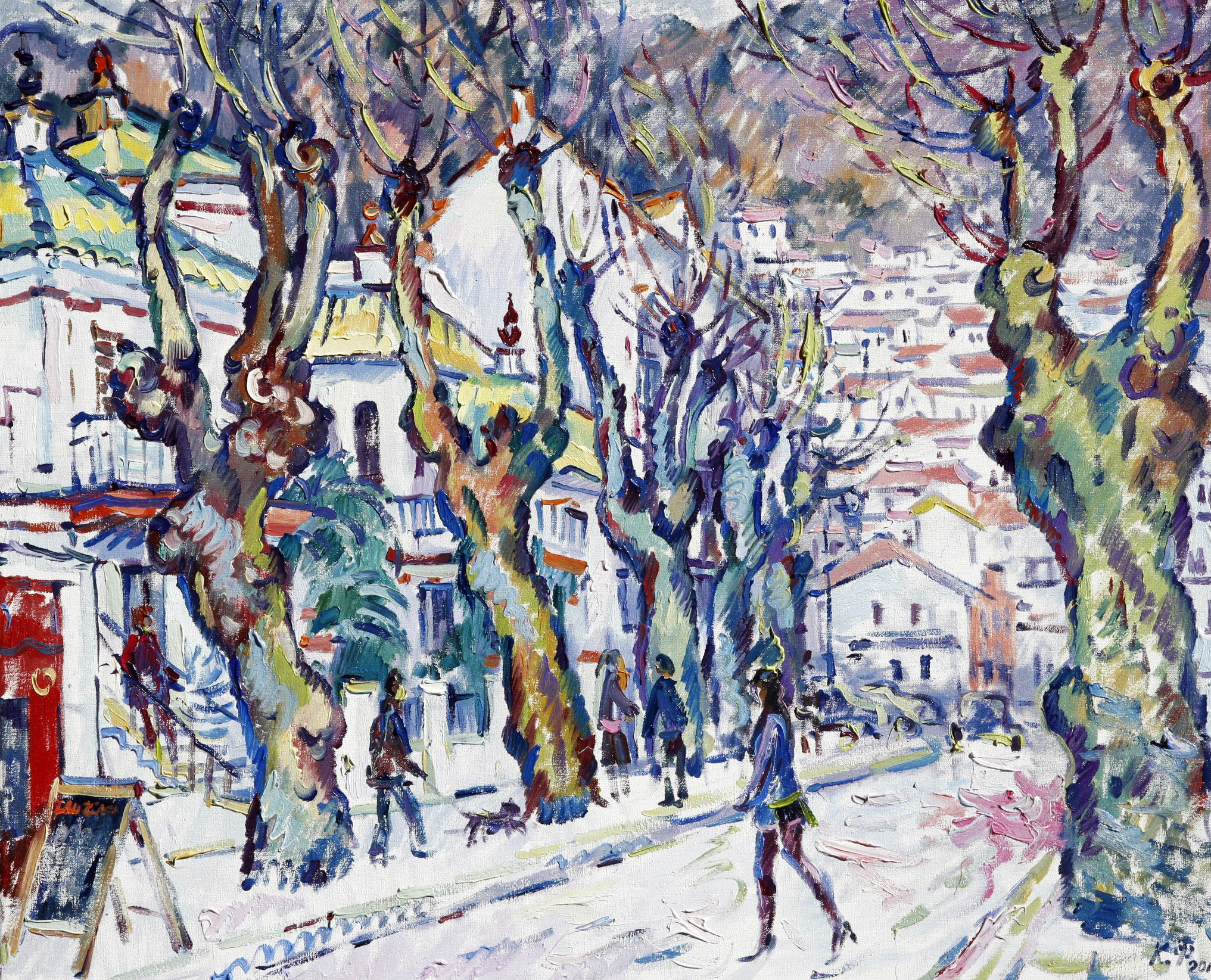 A street with trees overlooking houses standing on the mountain in Ubrique