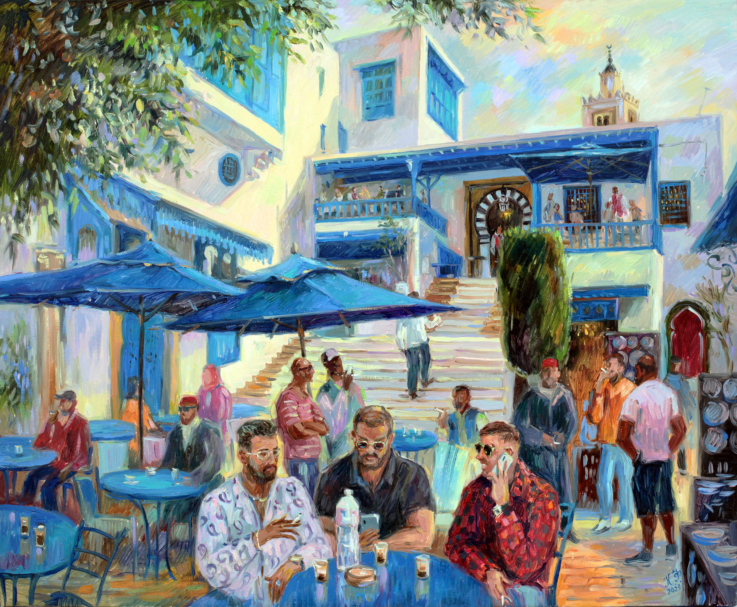 A group of three men drinking espresso in front of Café des Nattes.