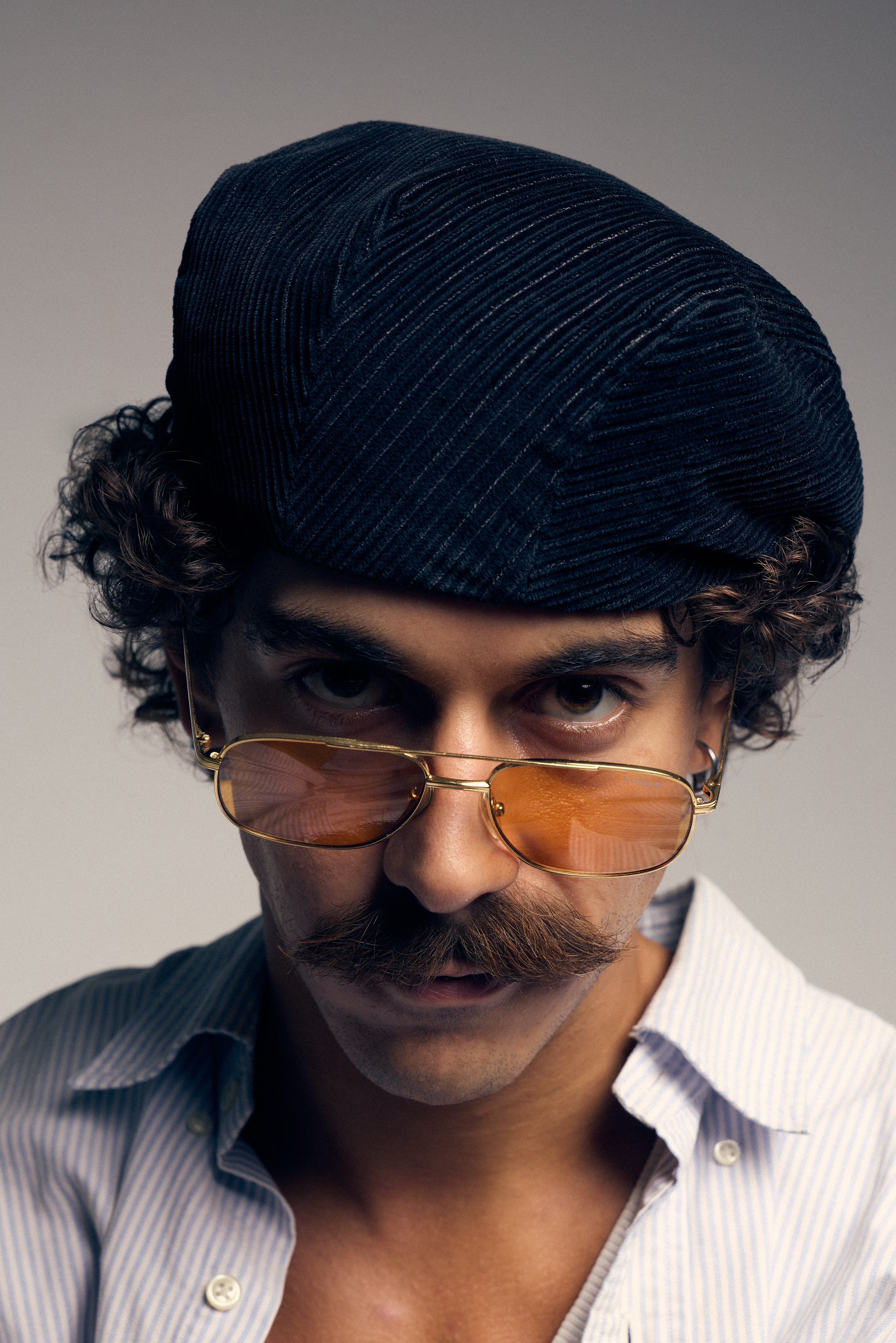 Man with vintage aesthetic in editorial style portrait