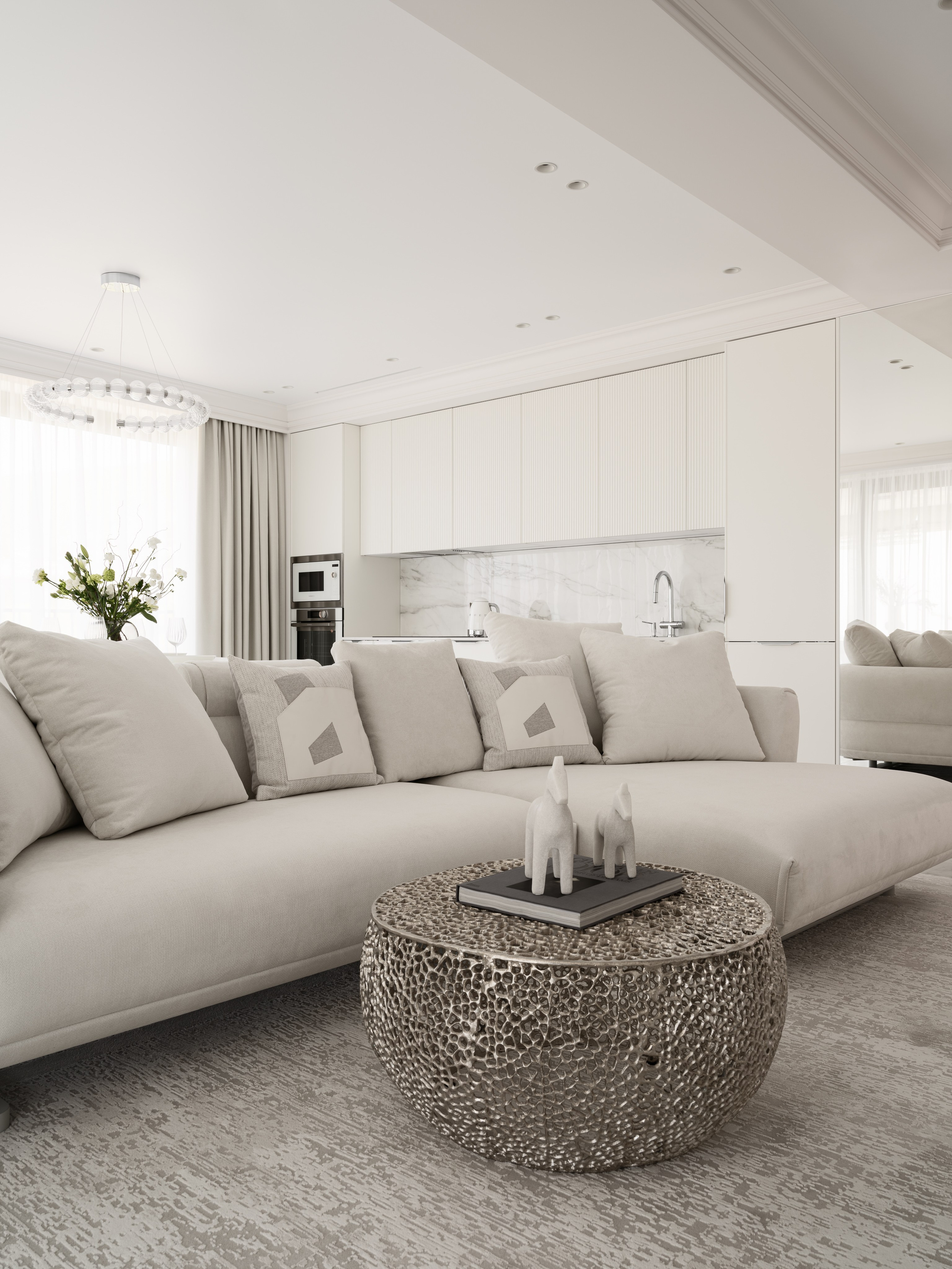 Интерьер гостиной-кухни открытого типа в светлых тонах, мягкий модульный диван, акцентный кофейный столик и мраморный фартук кухни — современный минимализм от дизайнера Алёны Боярской, стилист Наталья Якушева, фотограф Сергей Денисенко.