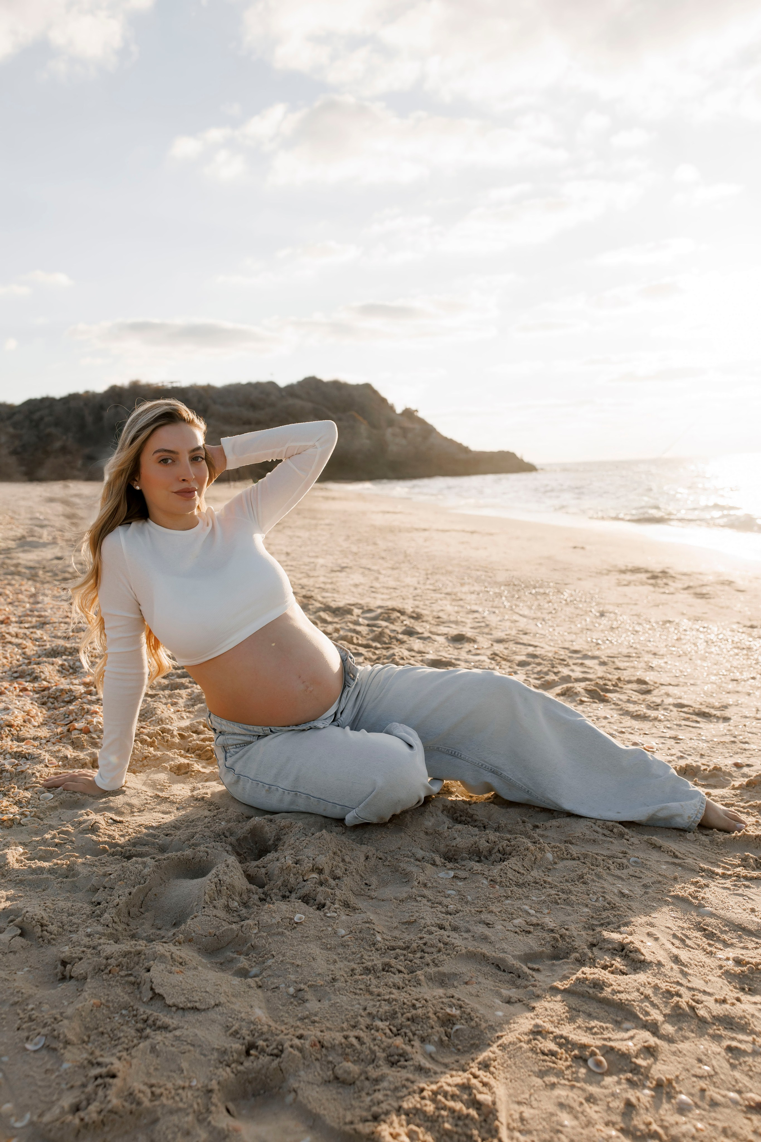 Pregnancy photoshoot near the sea. Wedding and family photographer