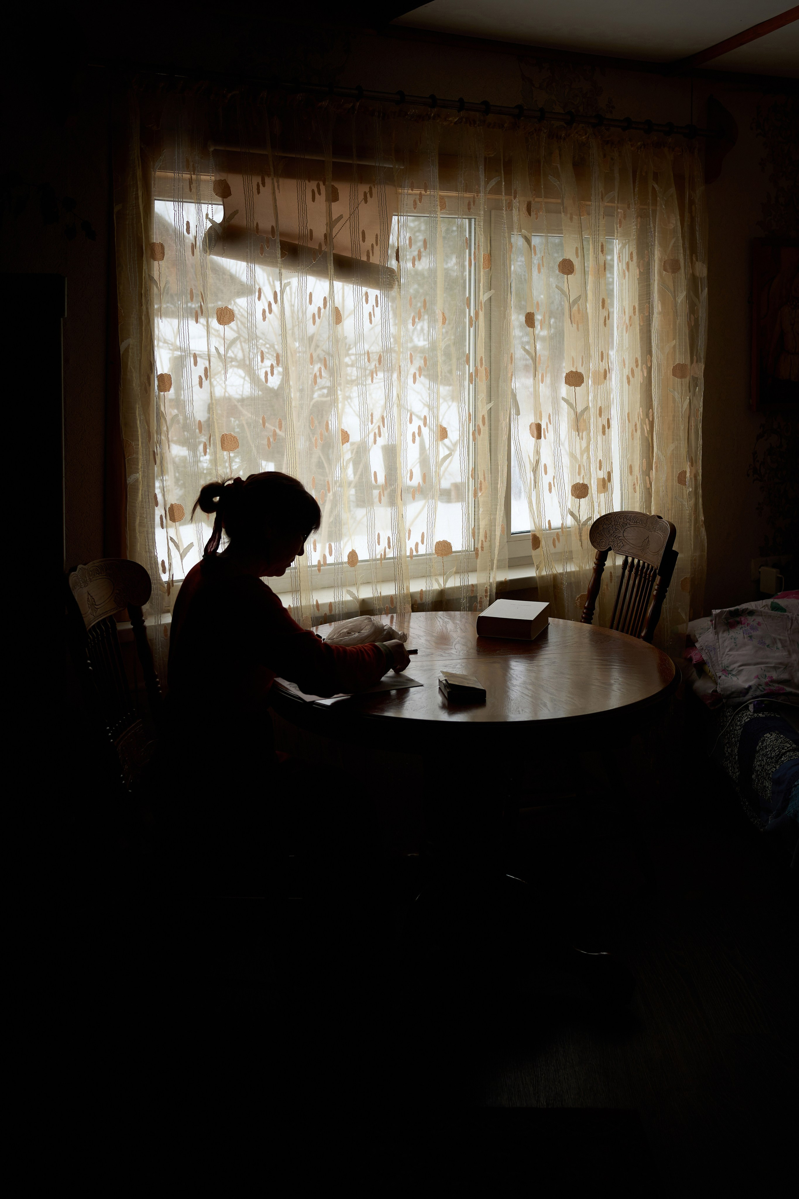 Lyubov Arbachakova is drawing with pastels in her home in the village of Ust-Kabyrza on March 8, 2025. Born in 1963 in a small Siberian village, after school her older brother directed her to study forestry rather than art. But she could not stop drawing. Her creative path was shaped by missed opportunities, the harsh realities of life in the Shor community, and obligations and responsibilities to her family. Despite these hardships, Lyubov’s perseverance allowed her to become a recognized artist.