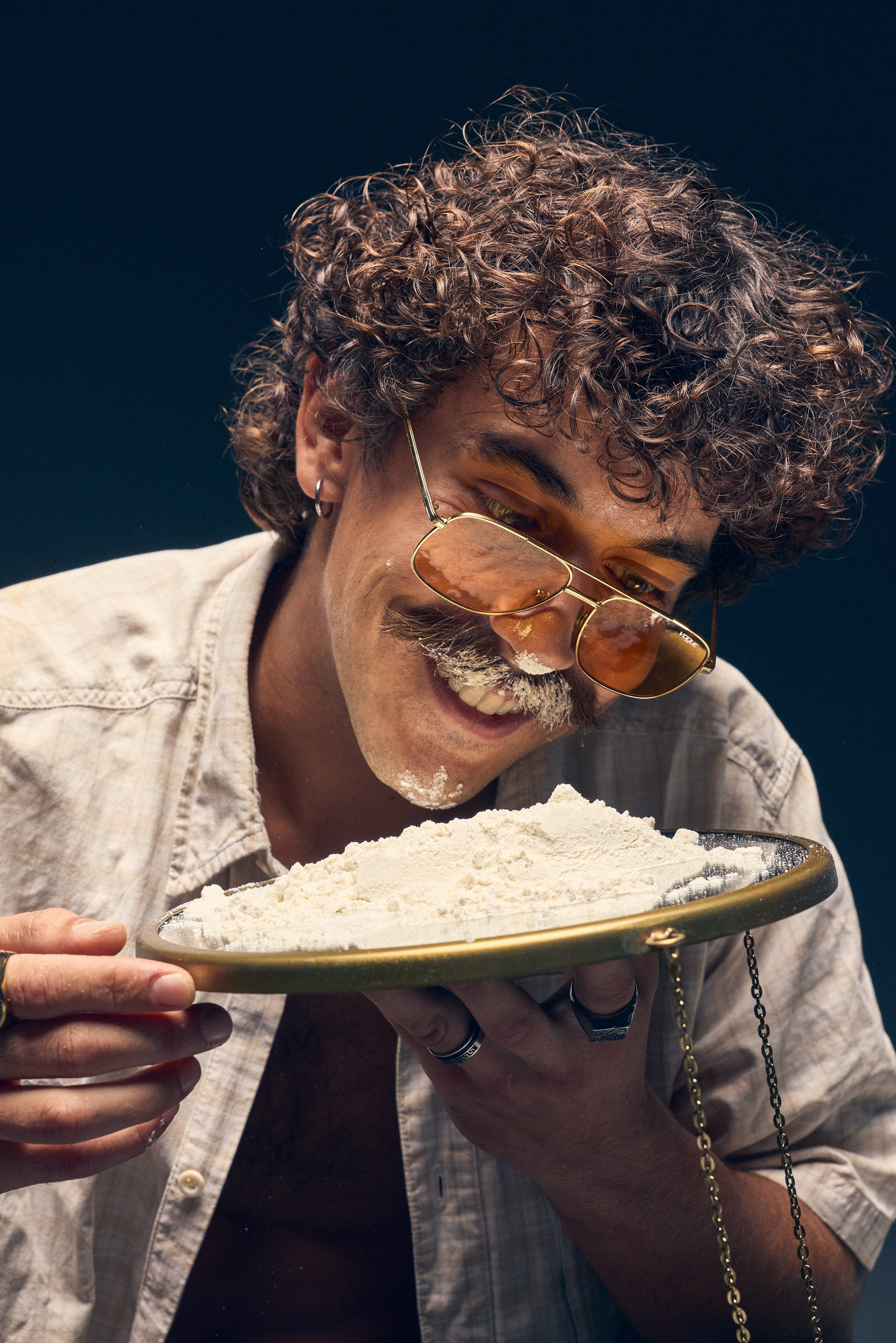 Retro styled photo shoot with male model and strong shadows