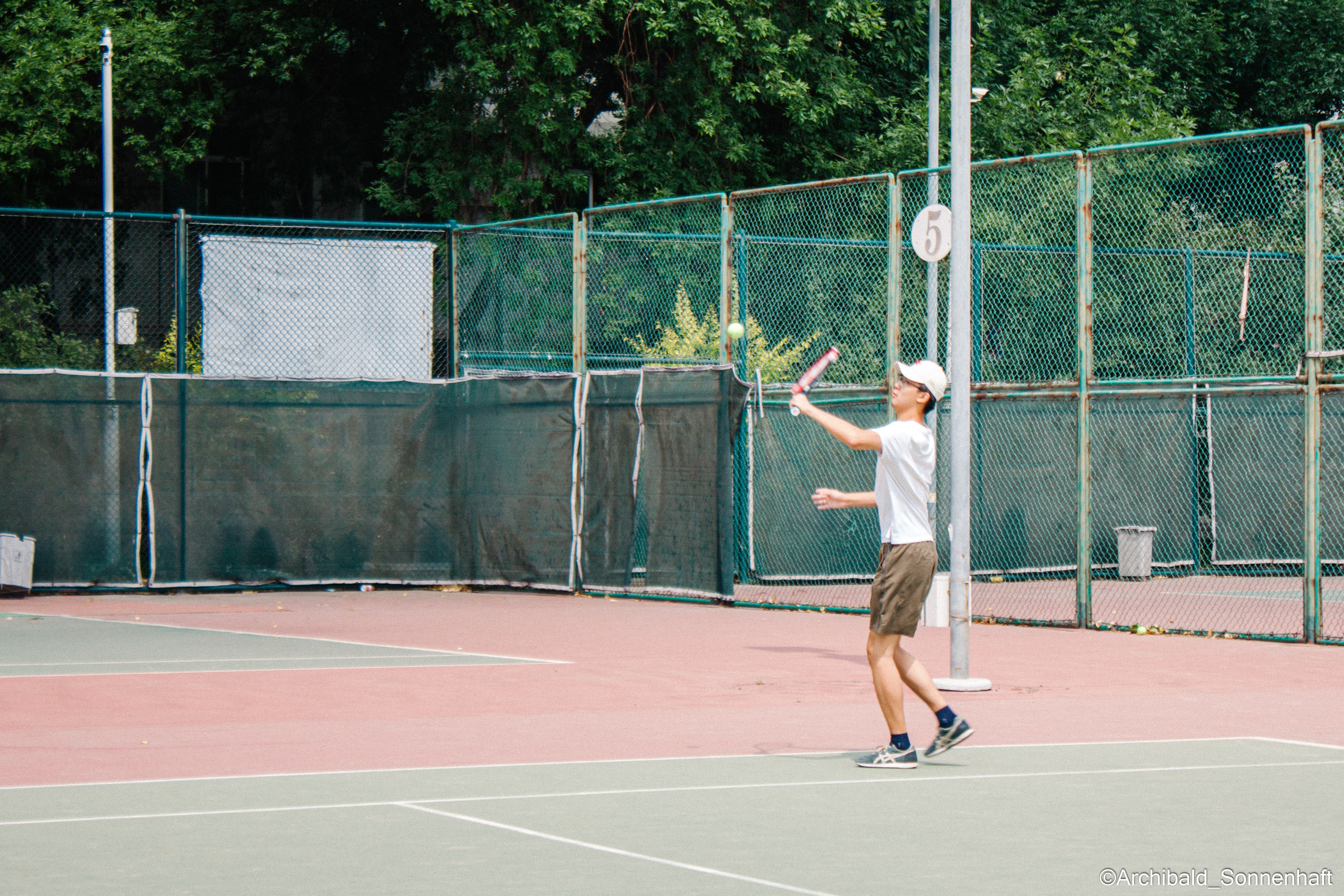 Tennis morning. Photographer in Guangzhou, China. Archibald Sonnenhaft