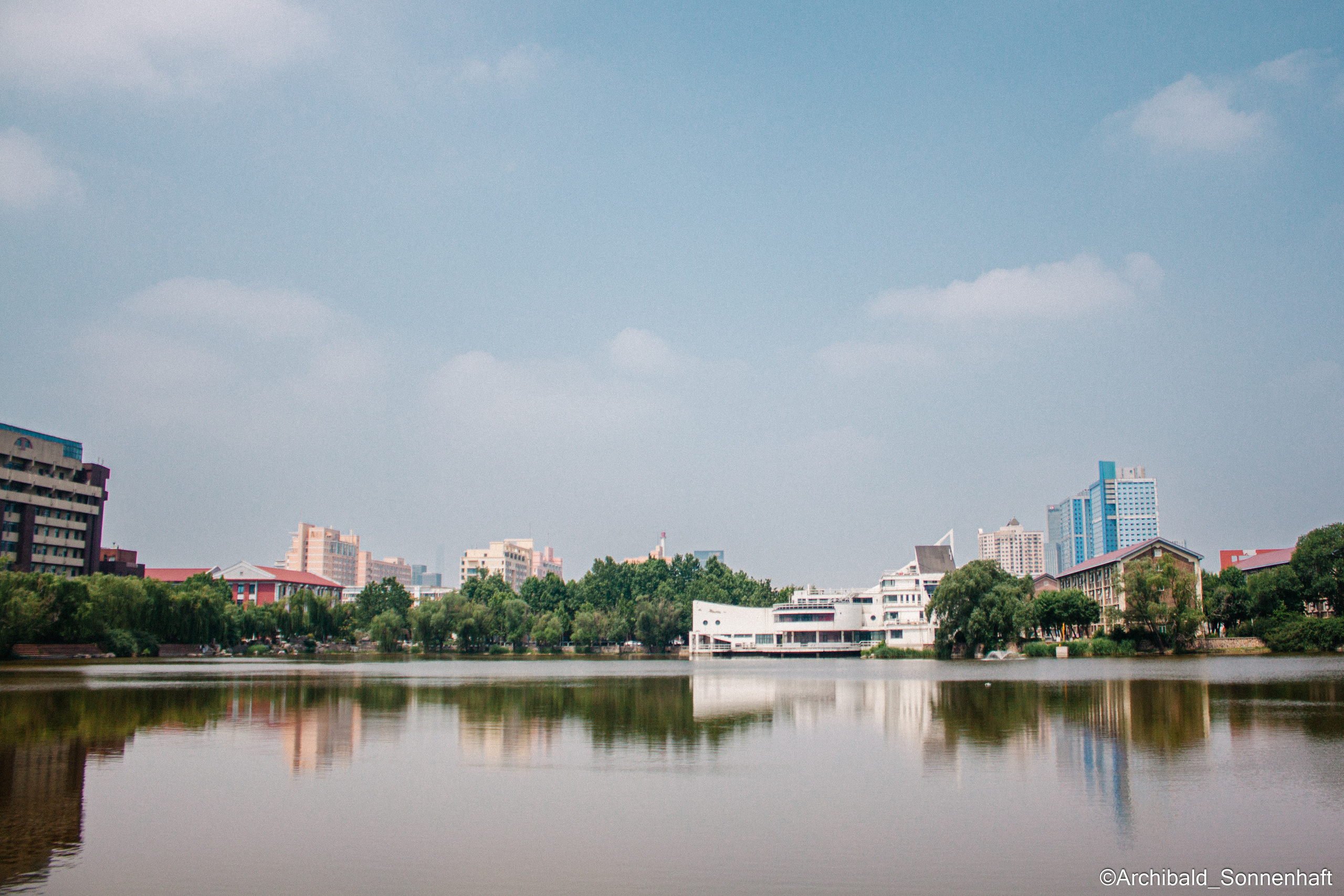 Tennis morning. Photographer in Guangzhou, China. Archibald Sonnenhaft