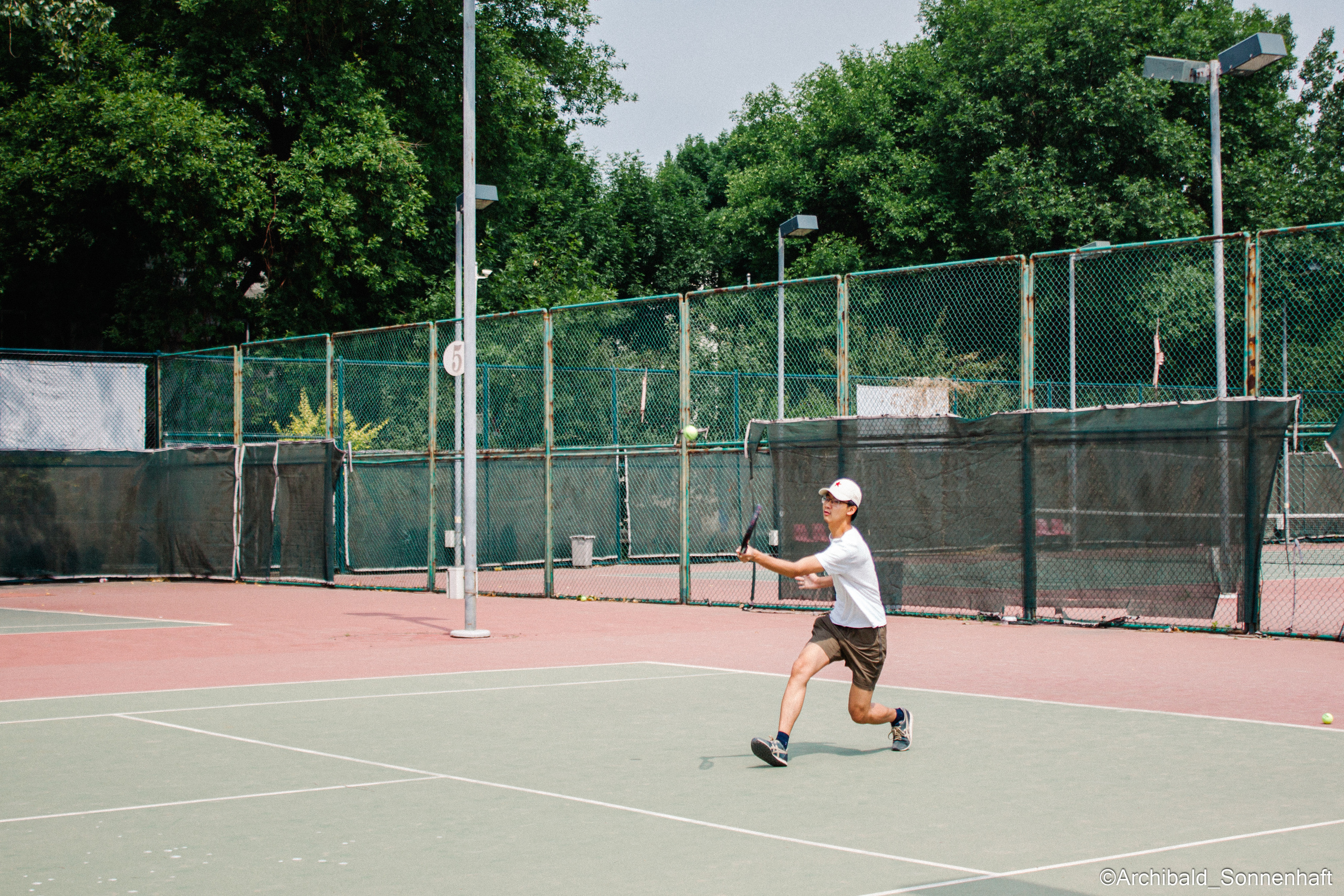 Tennis morning. Photographer in Guangzhou, China. Archibald Sonnenhaft