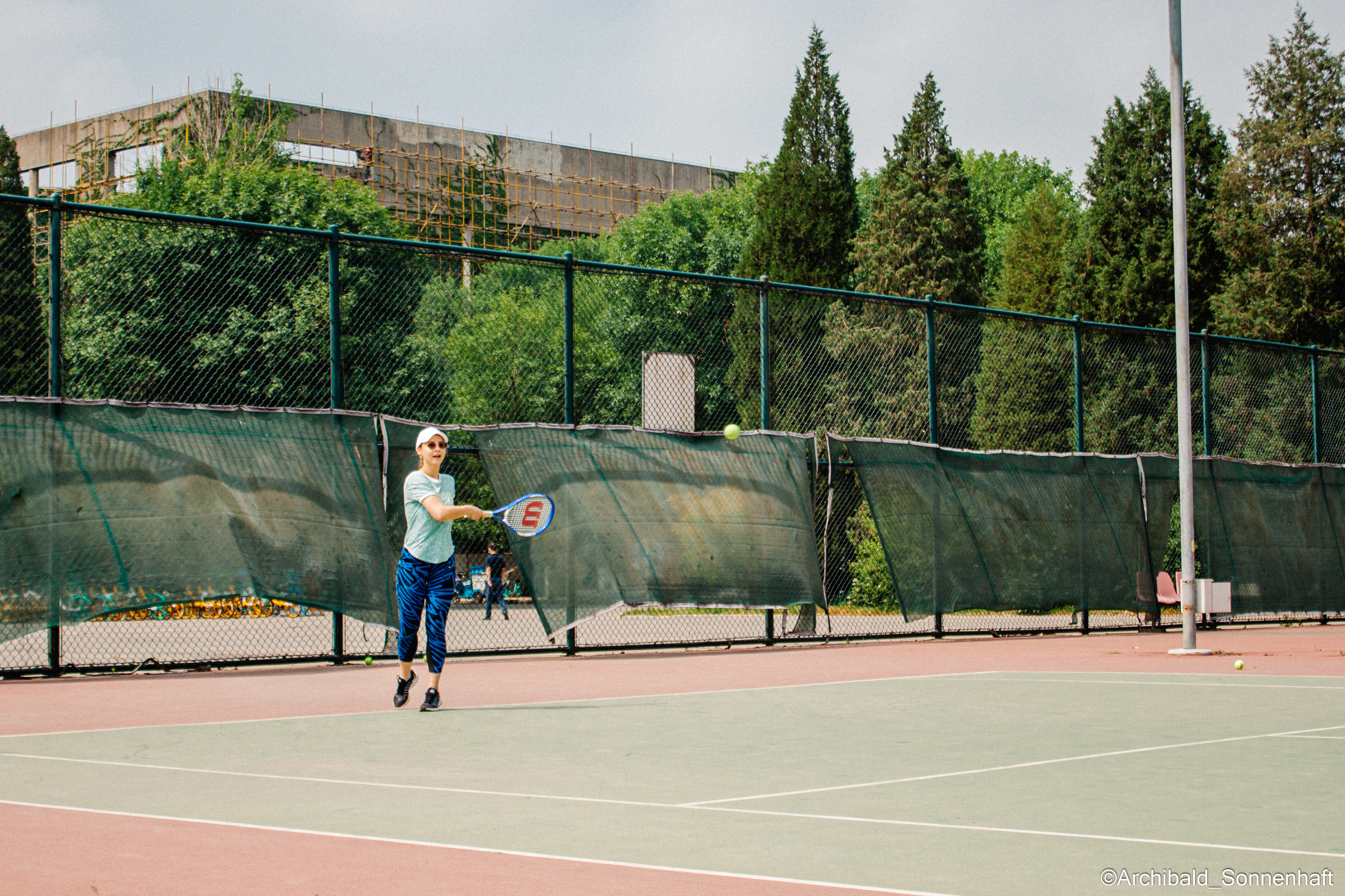 Tennis morning. Photographer in Guangzhou, China. Archibald Sonnenhaft