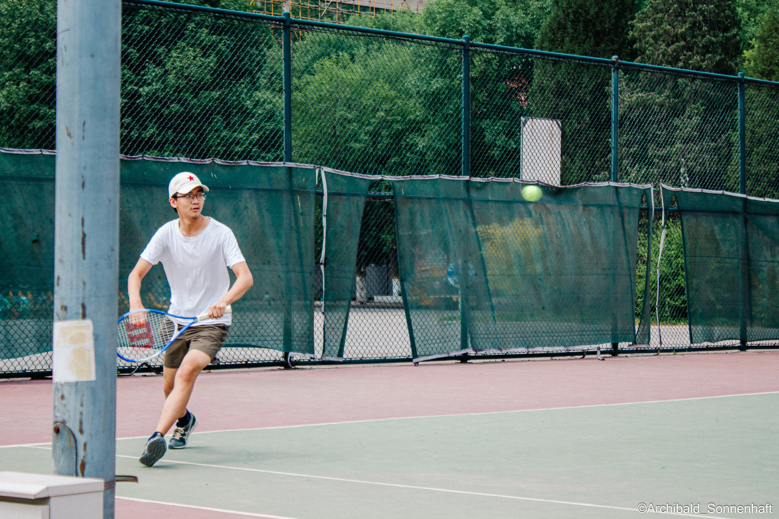 Tennis morning. Photographer in Guangzhou, China. Archibald Sonnenhaft