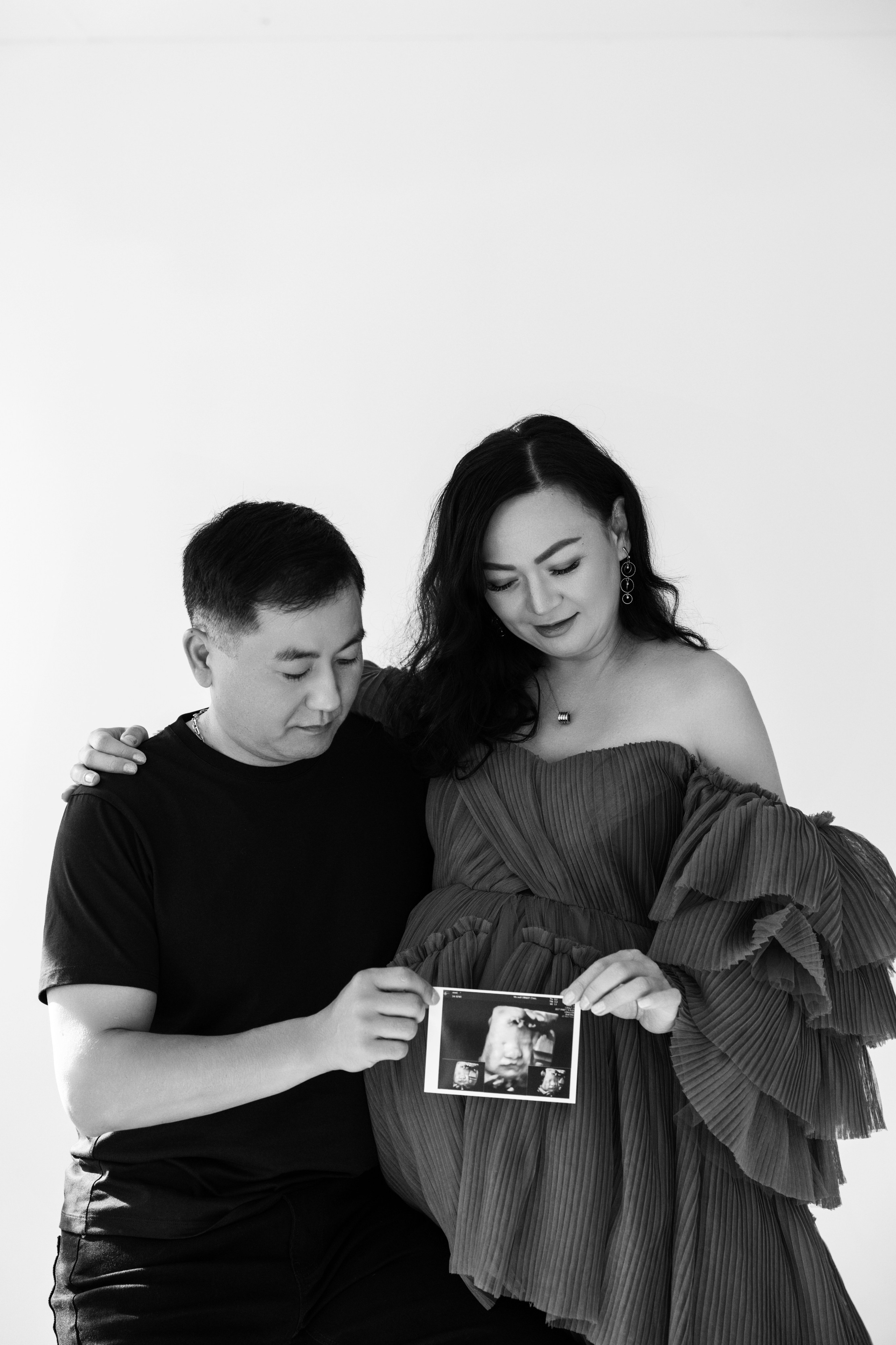 Pregnancy photo session with husband in studio